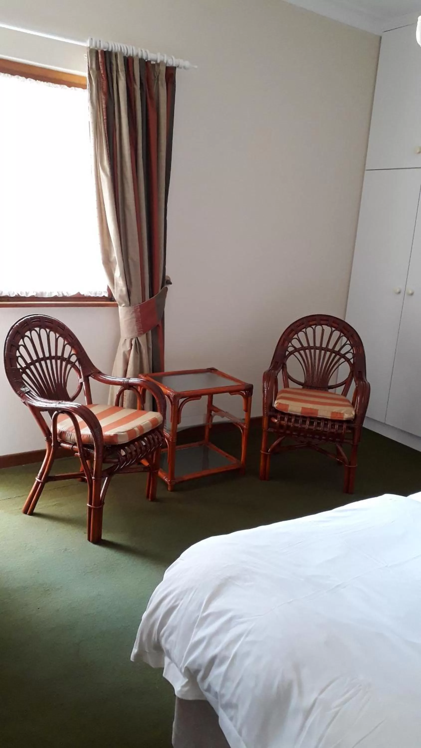 Seating area, Bed in Hansa Hotel Swakopmund