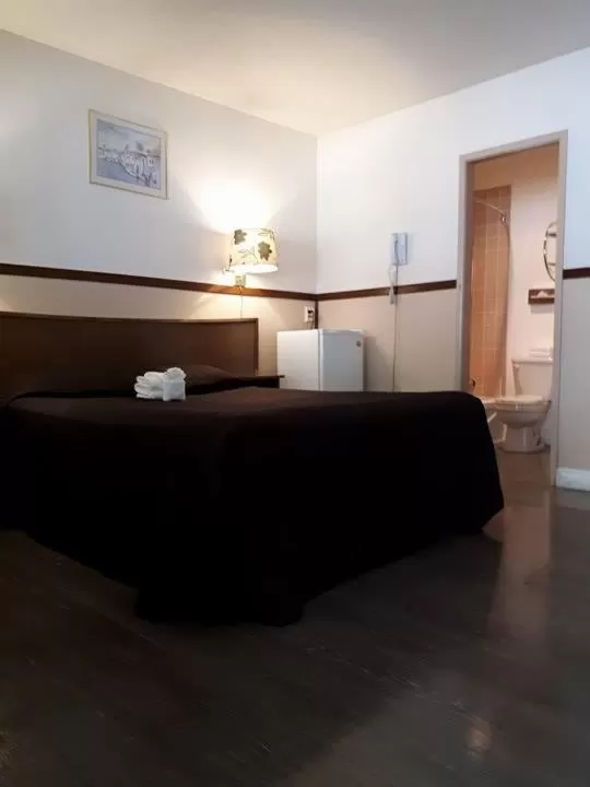 Bed in Falcon Nest Motel