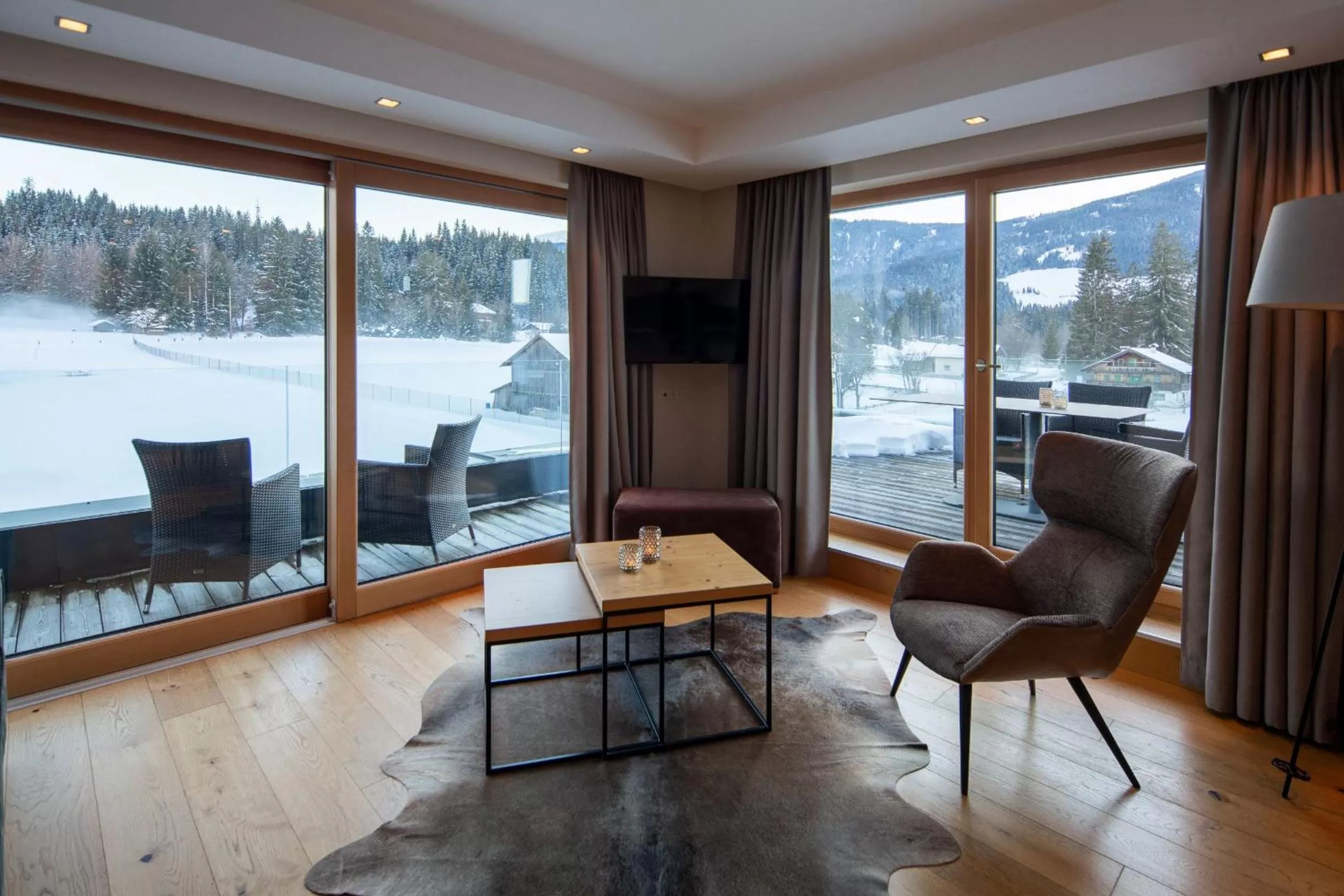 Living room in Berg & Golf Resort Westendorf by ALPS RESORTS