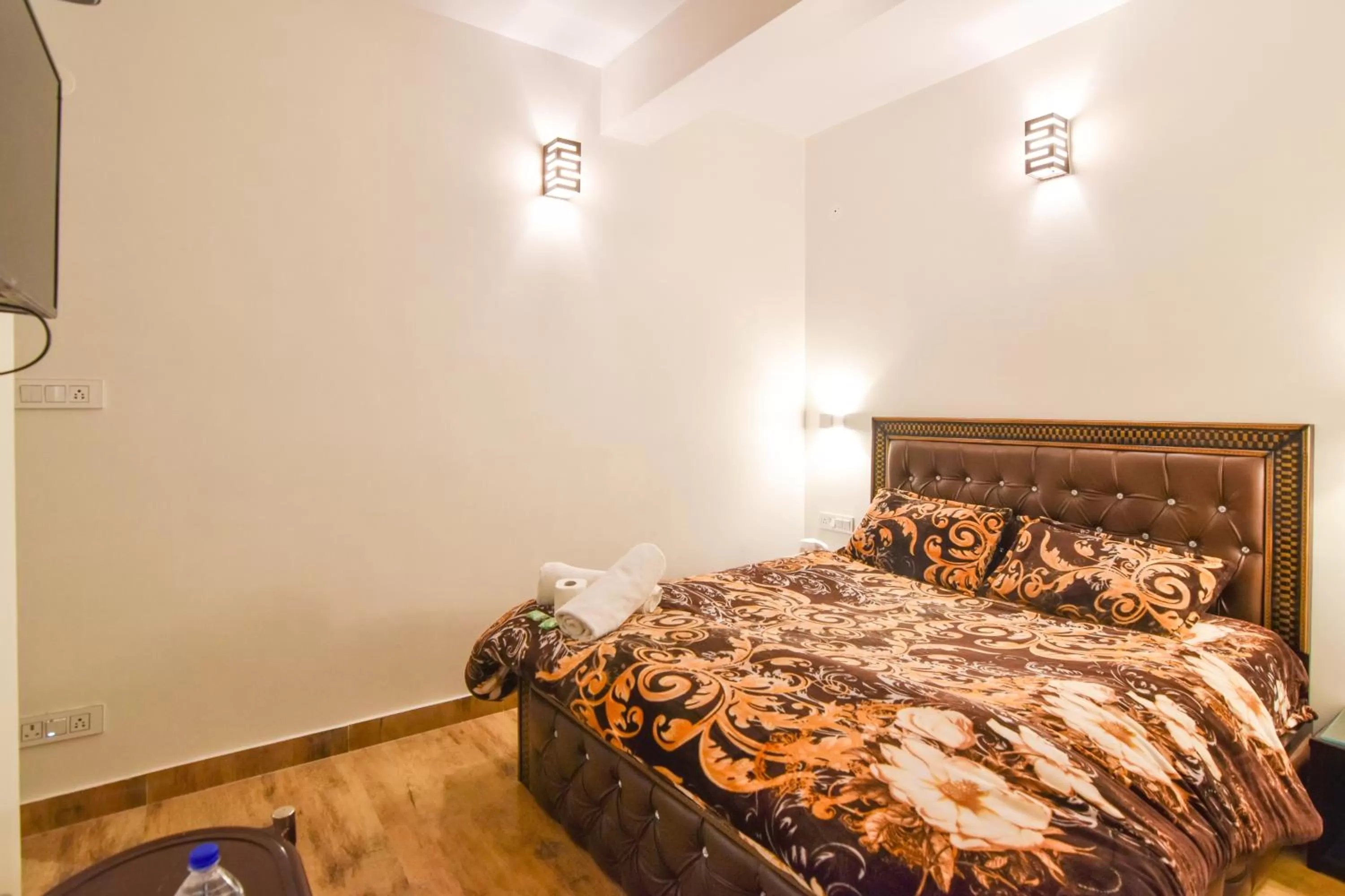 Bedroom, Bed in Dhanlaxmi Apartments