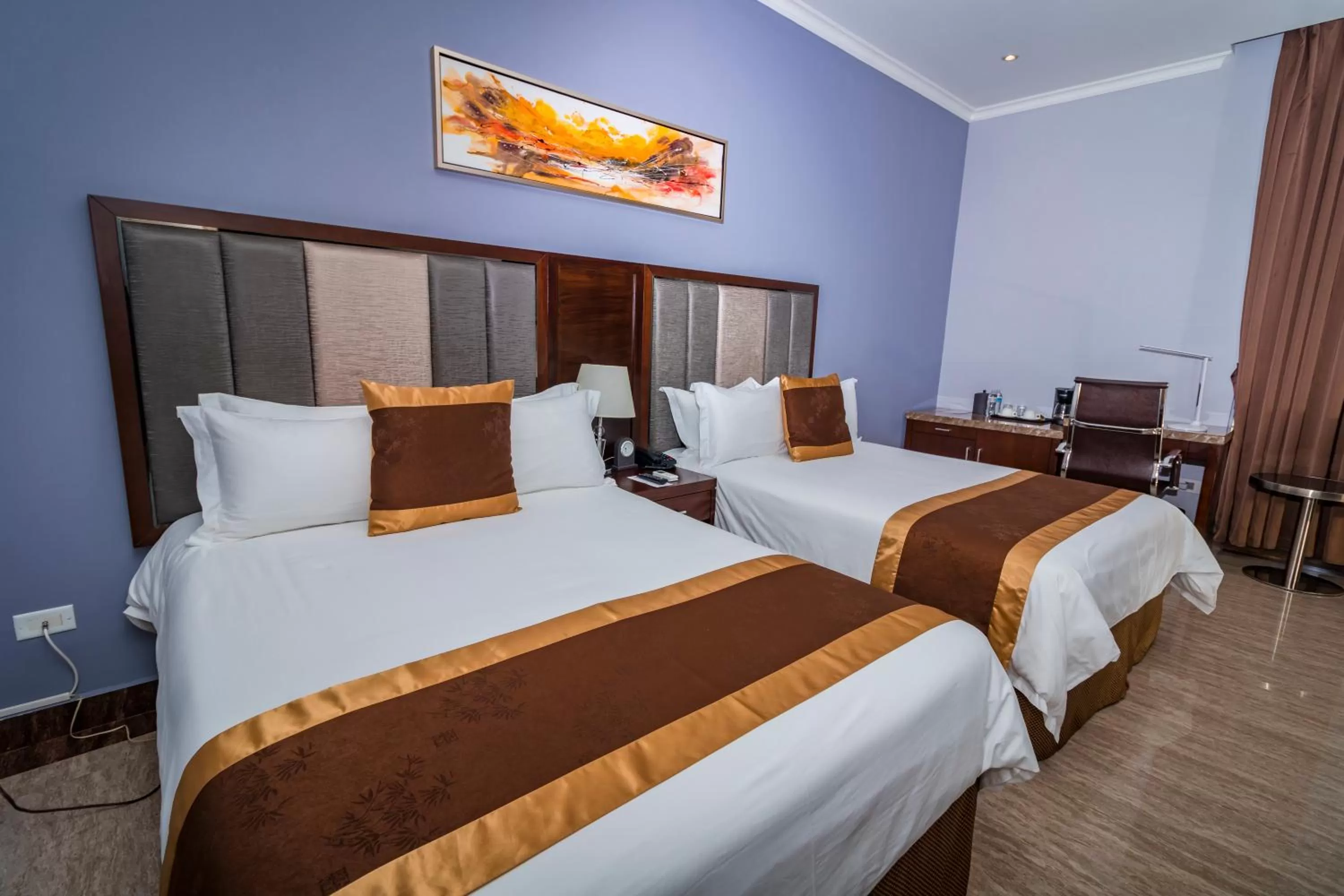 Bed in Hotel City Plaza & Suites