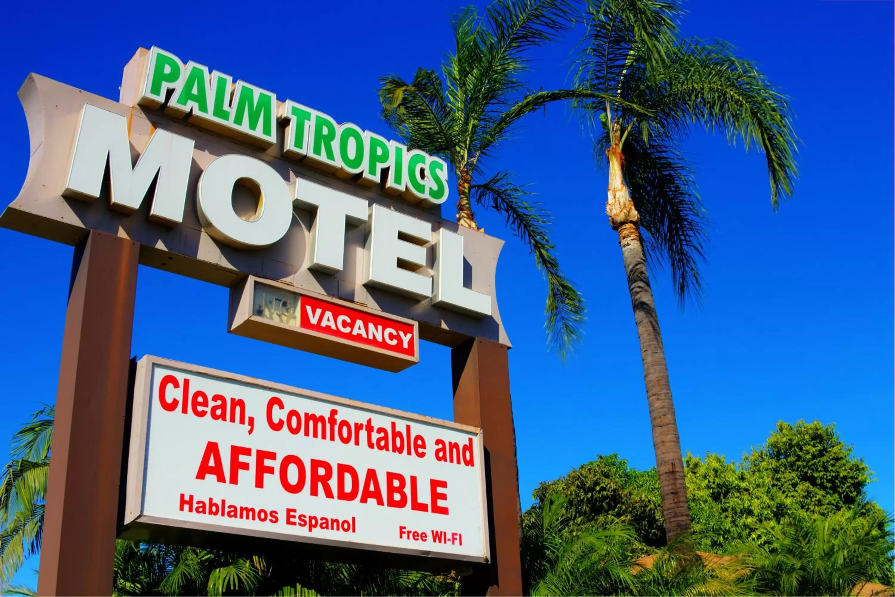 Property logo or sign in Palm Tropics Motel