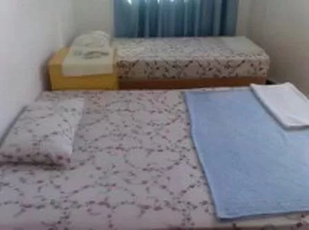 Bed in Sunrise Hotel