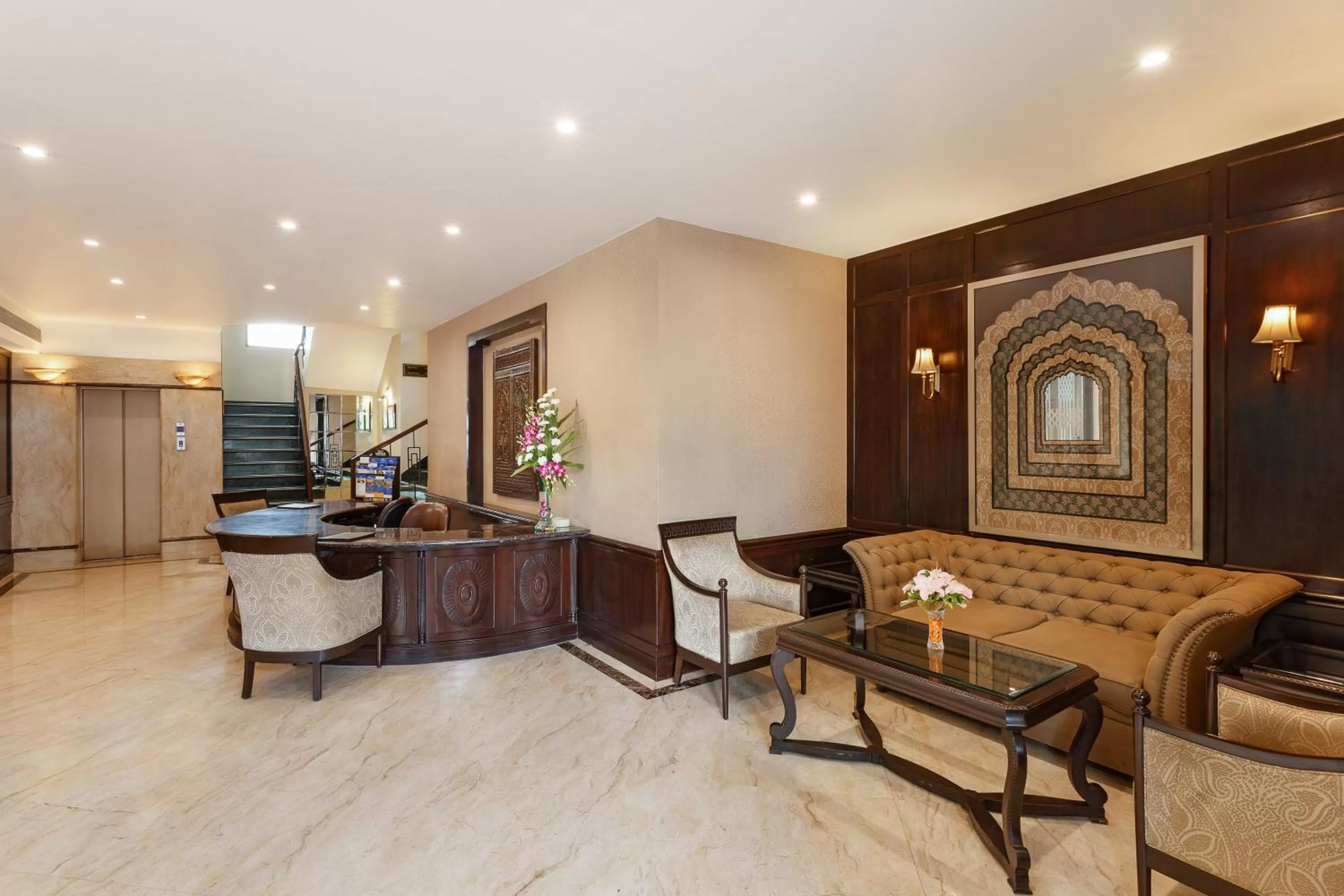 Lobby or reception in La Place Sarovar Portico