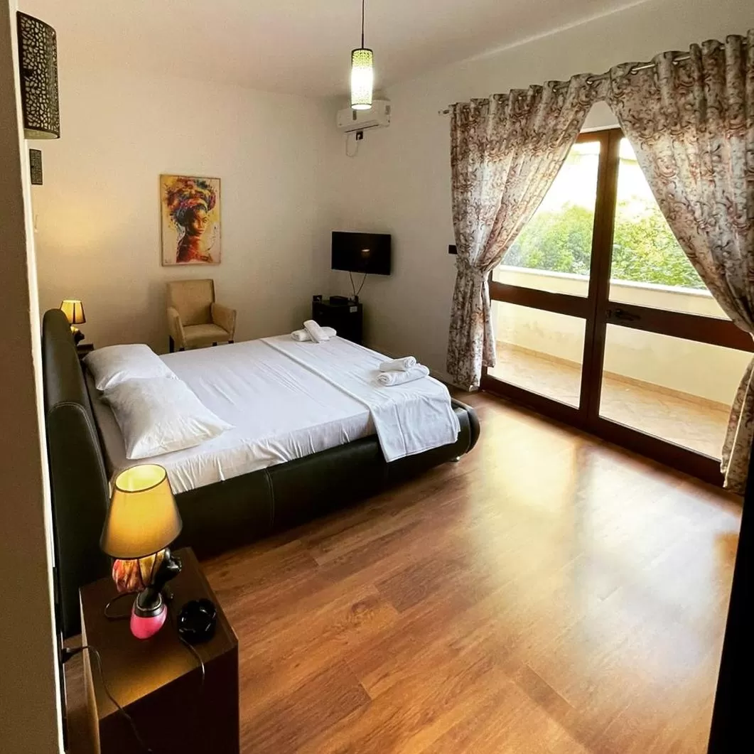 Bed in Hotel Ambasador Garden