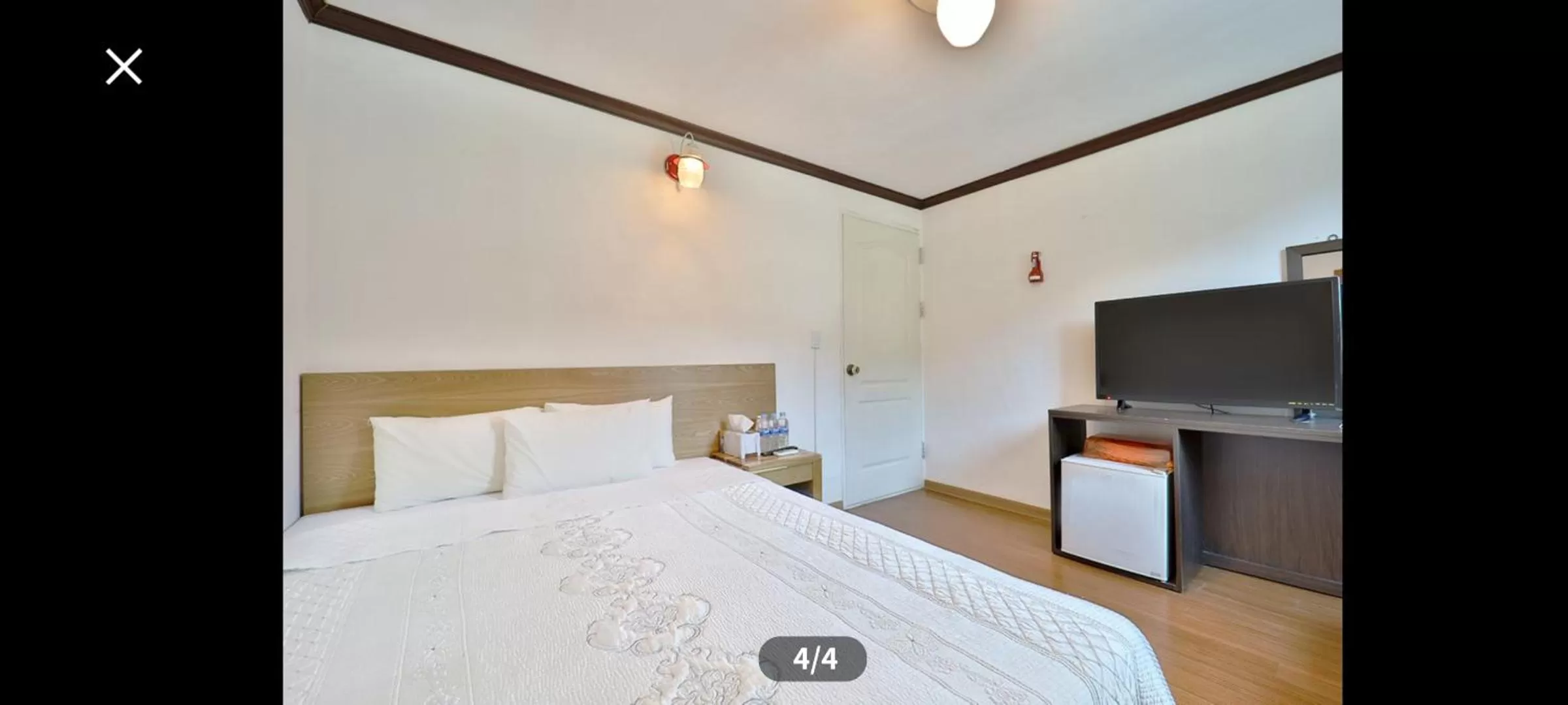 Bed in Saipan Motel with Sea View