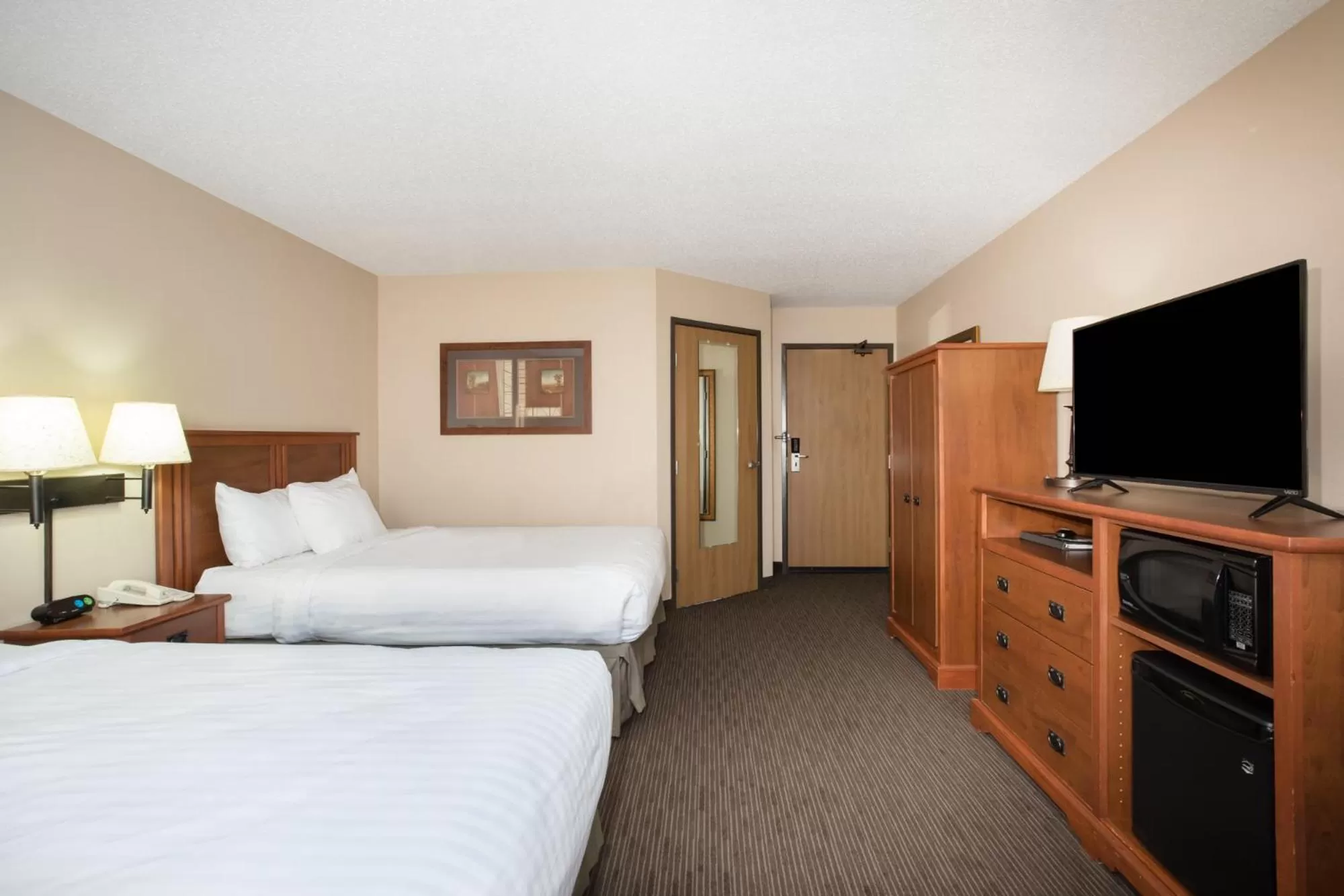 Bed in AmericInn by Wyndham Sioux City