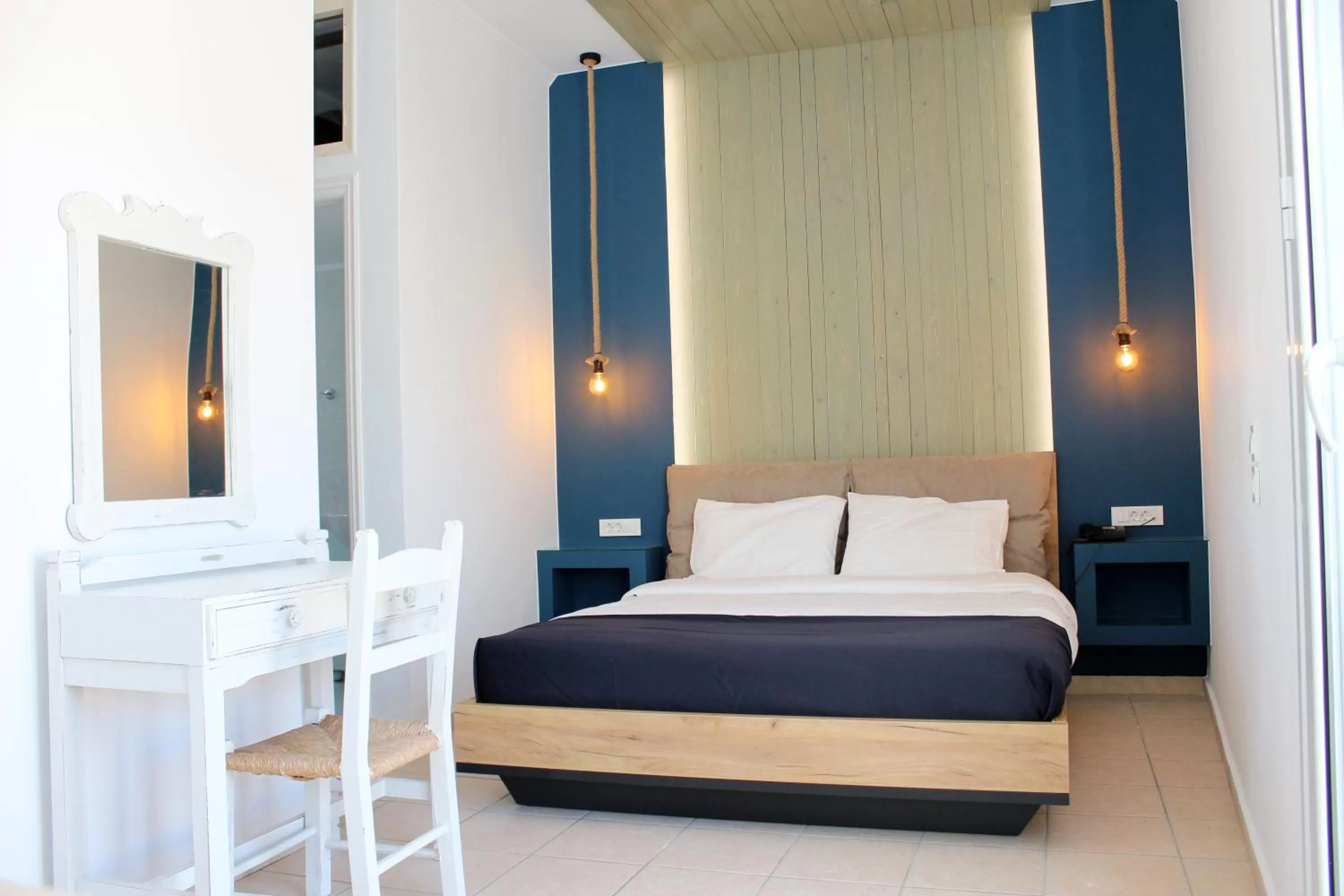 Bed in Ikaros Art Hotel