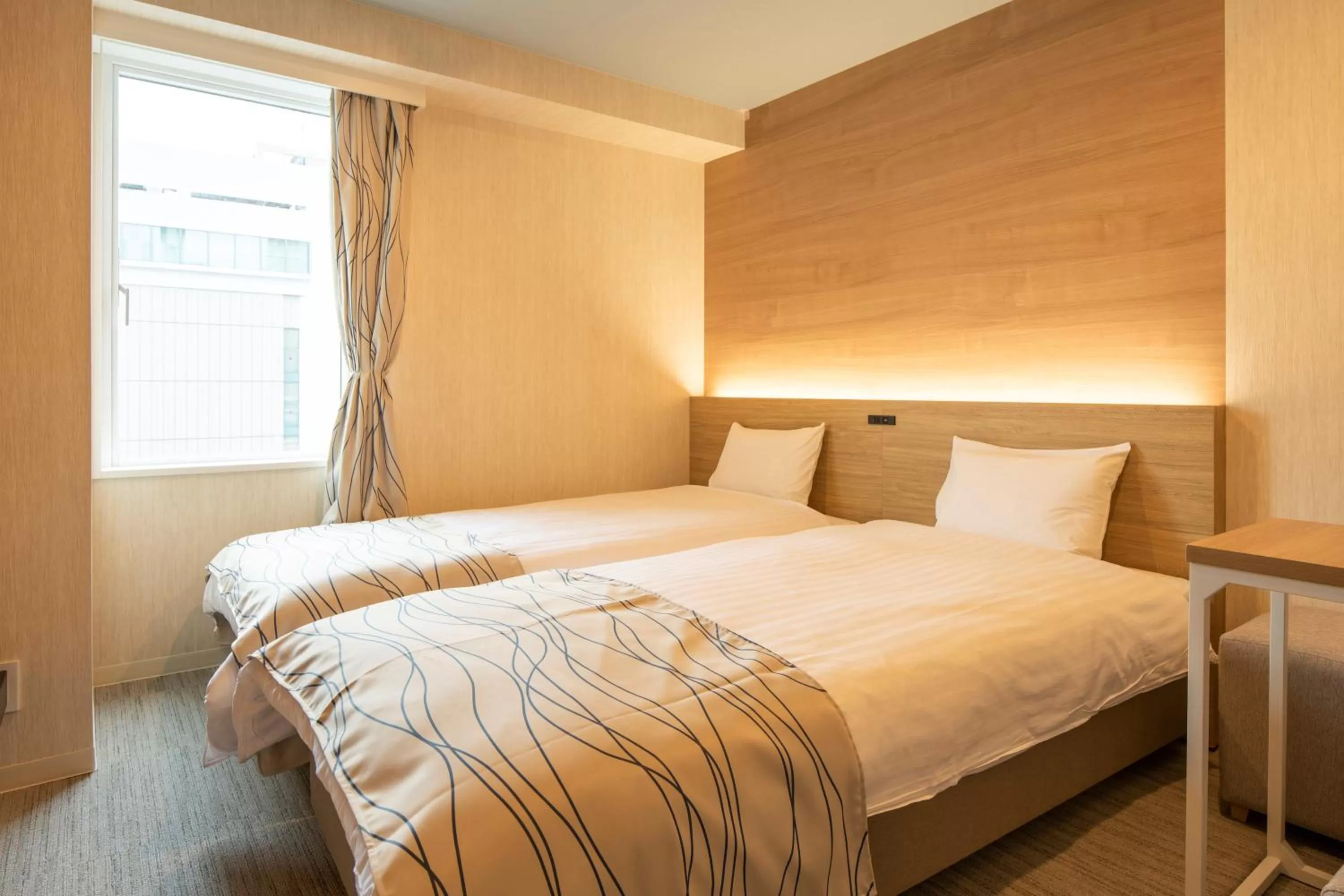 Bed in HOTEL AMANEK Asahikawa