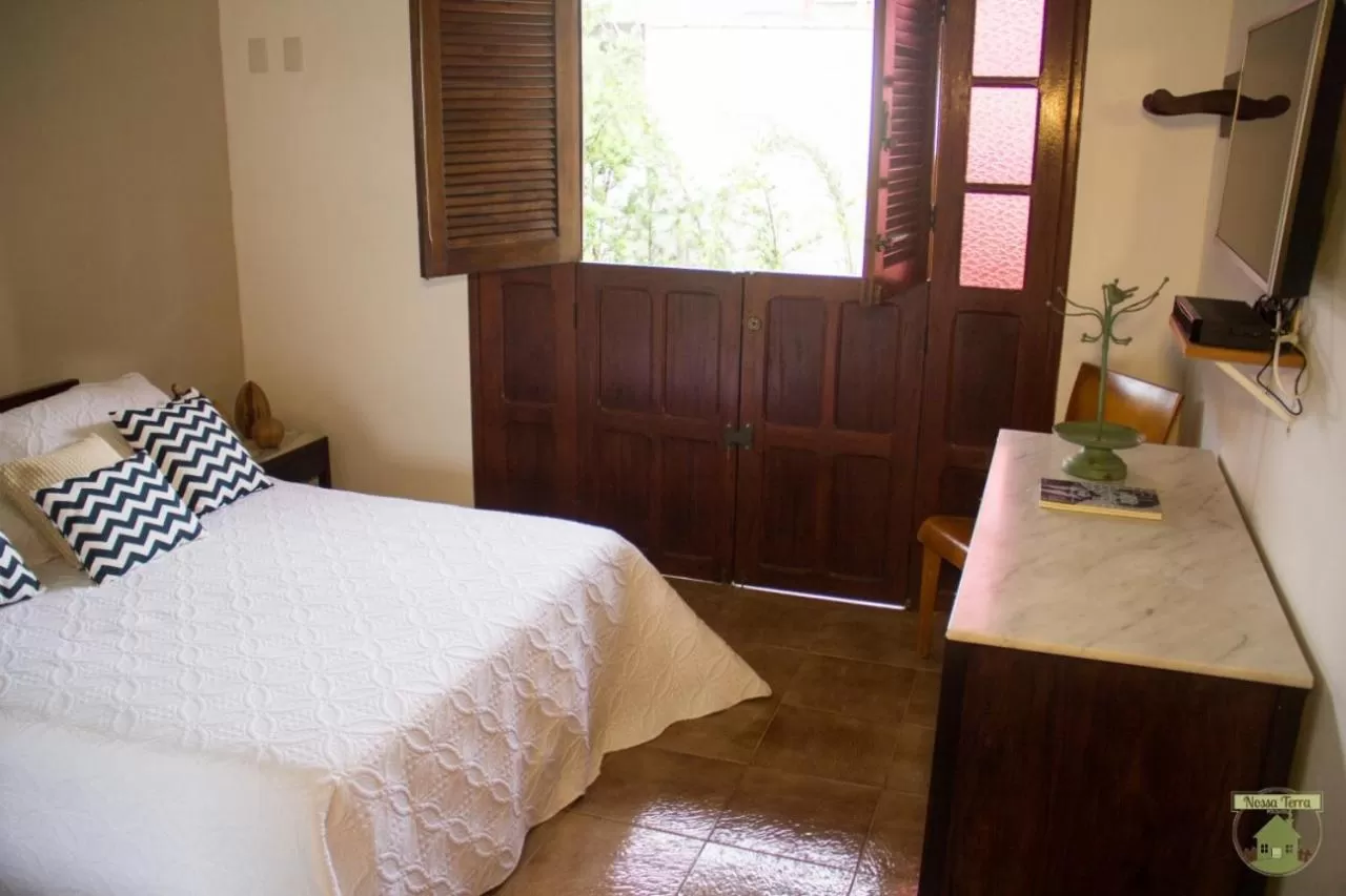 Bed in Pousada Nossa Terra