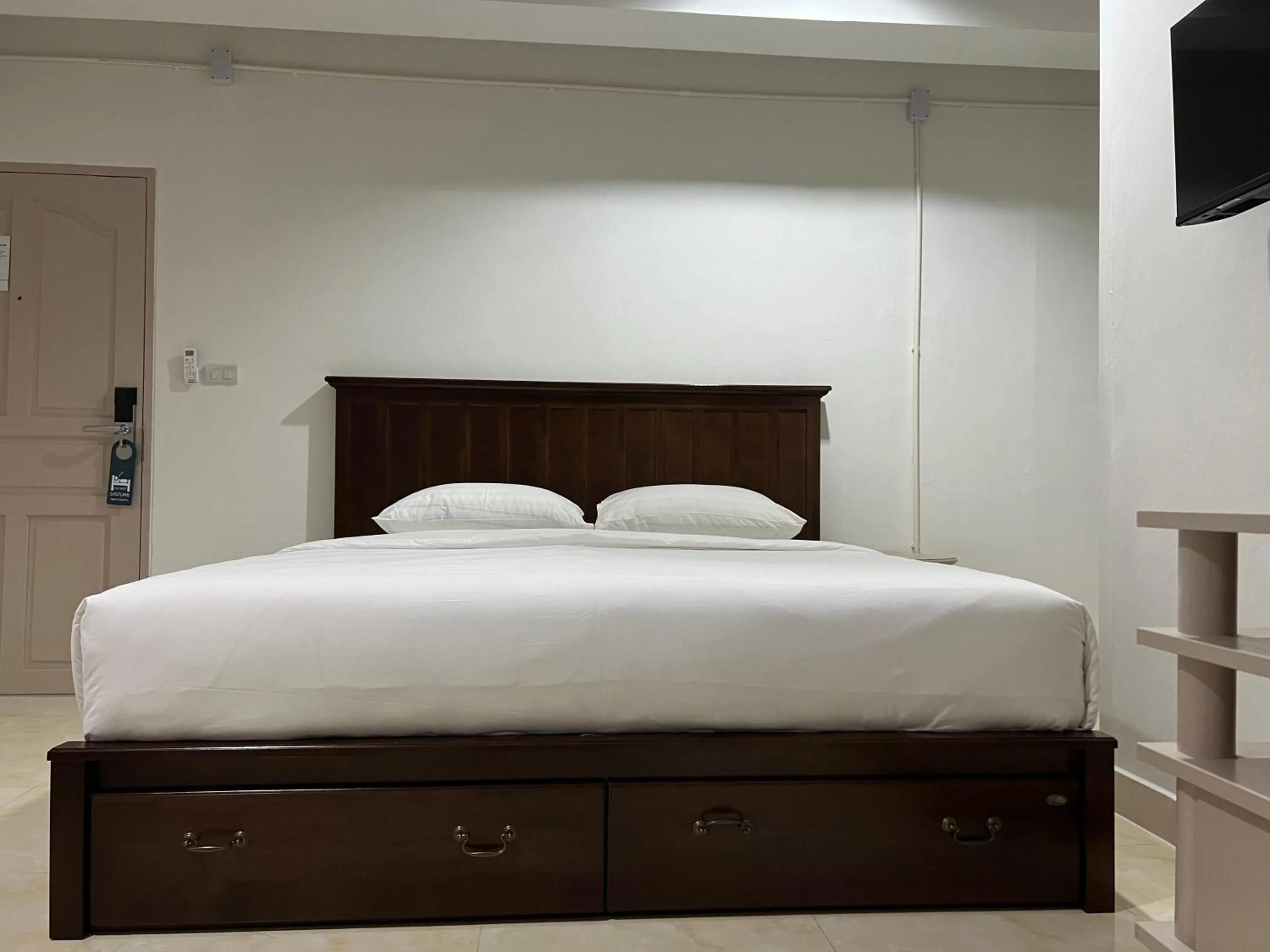 Bed in Mall Suites Hotel