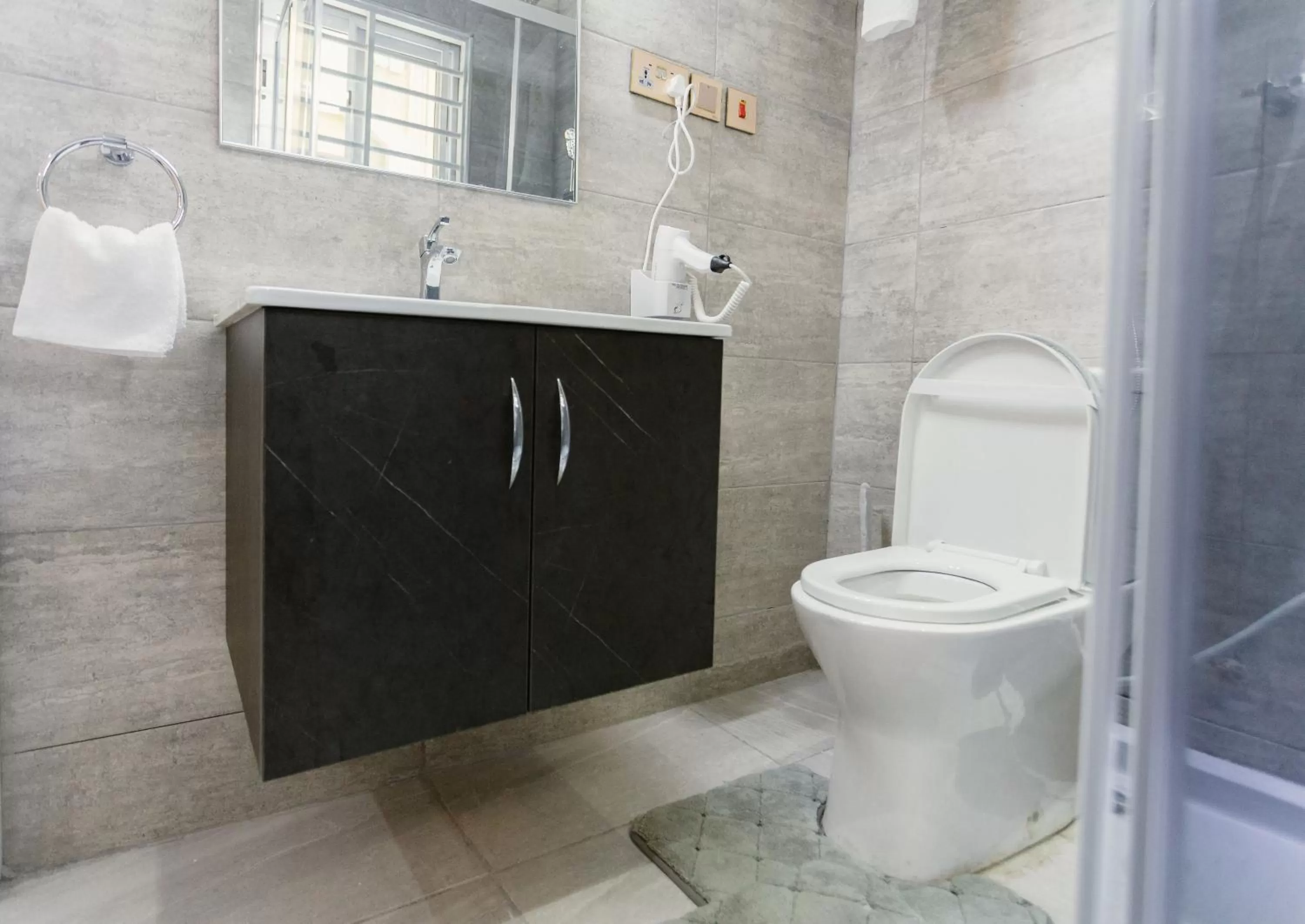 Toilet, Bathroom in The Avery Suites, East Legon