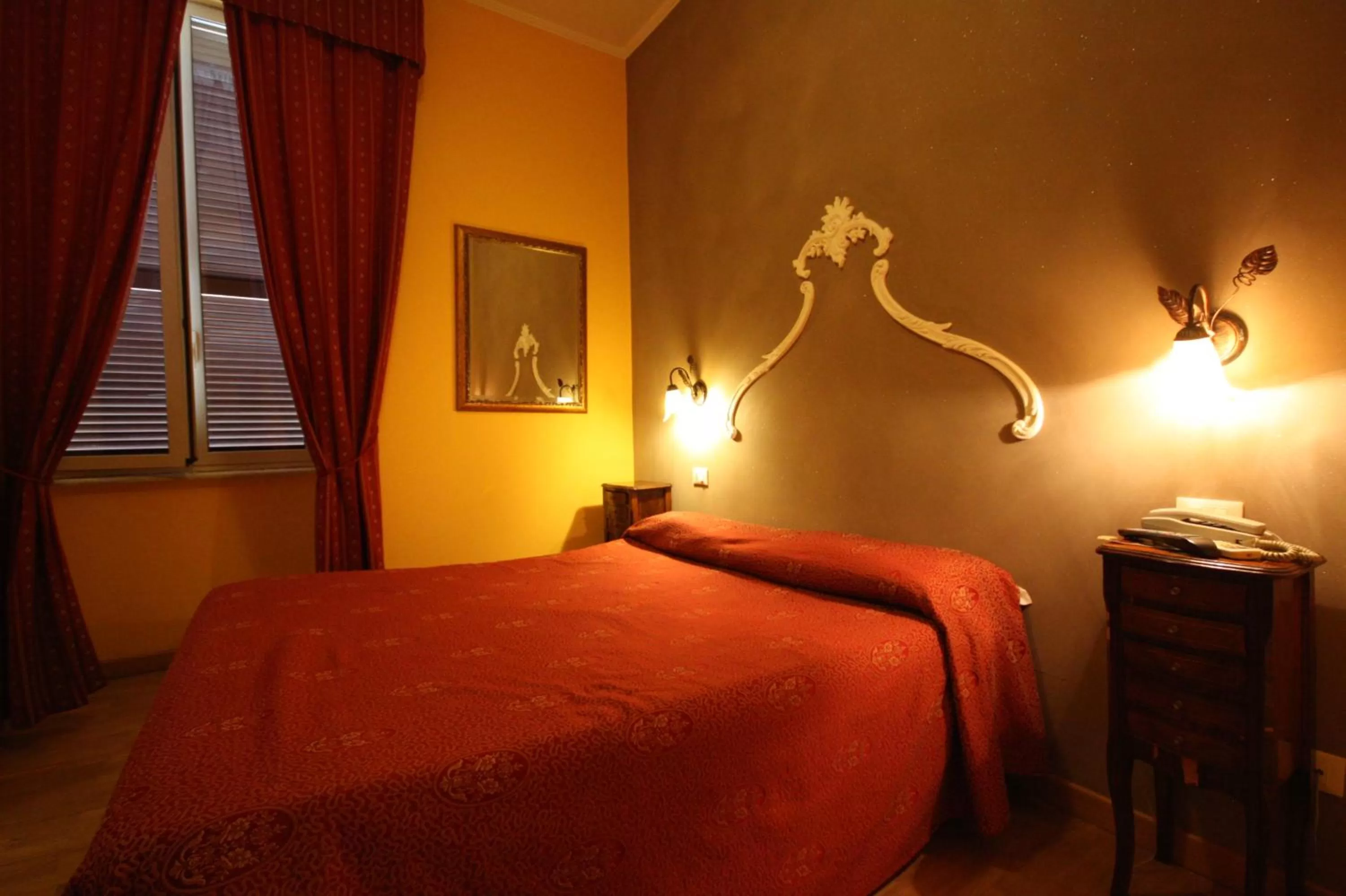 Bed in Hotel Cherubini