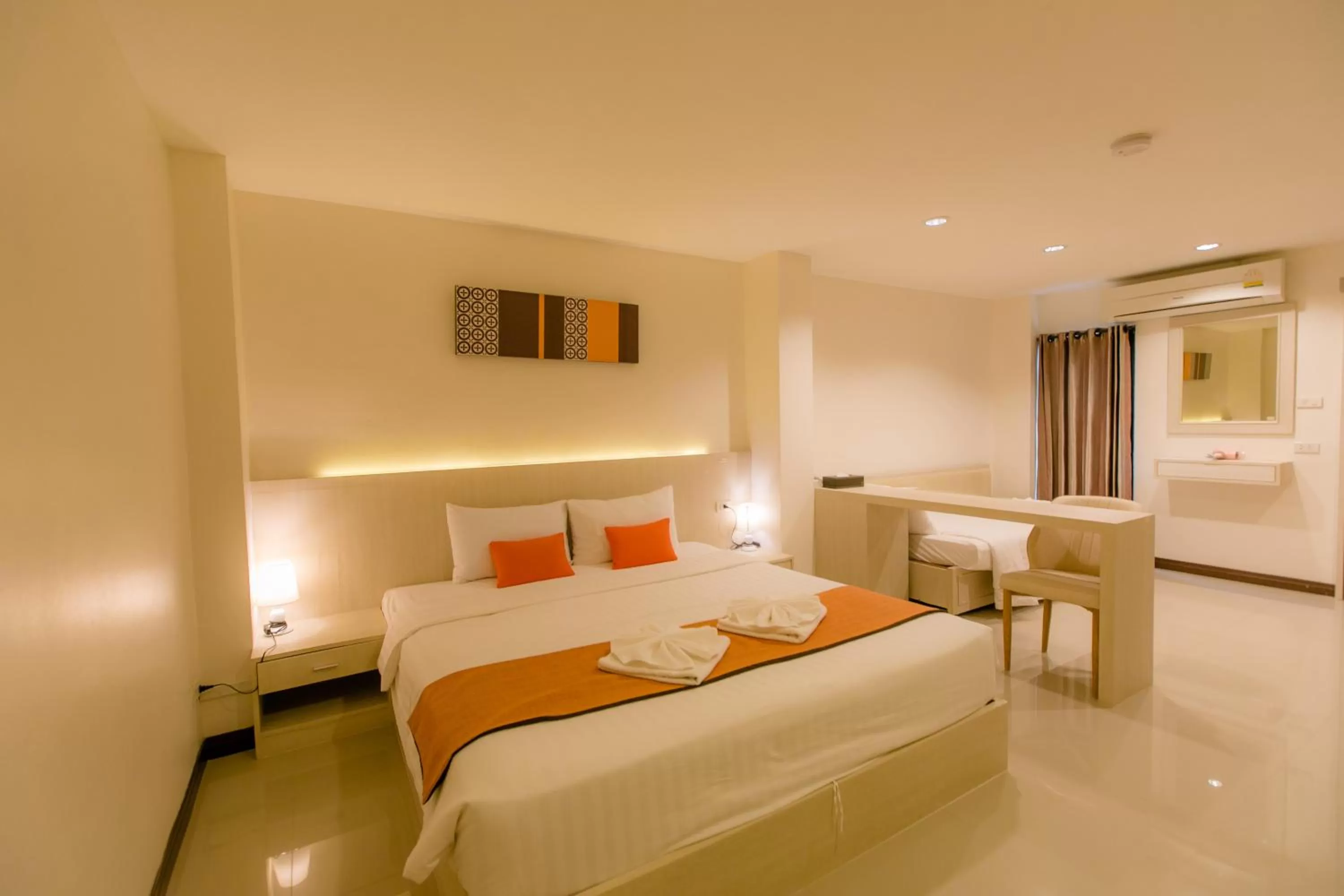 Bed in De Hug Hotel & Residence