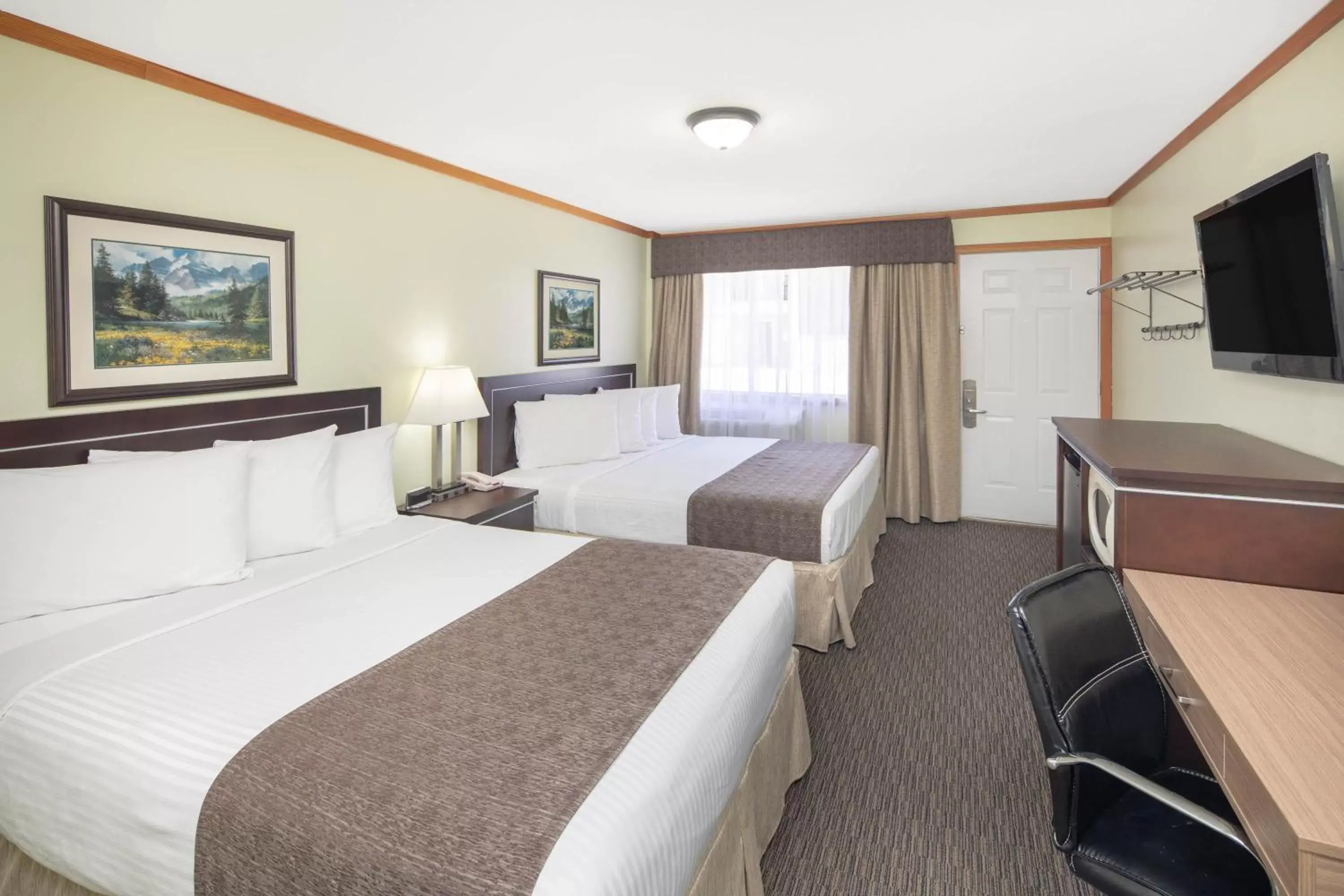 Studio Suite - Two Queen Beds with Kitchen - Non-Smoking - Ground Floor in Travelodge by Wyndham Golden Sportsman Lodge Studio Suite - Two Queen Beds with Kitchen - Non-Smoking - Ground Floor in Travelodge by Wyndham Golden Sportsman Lodge