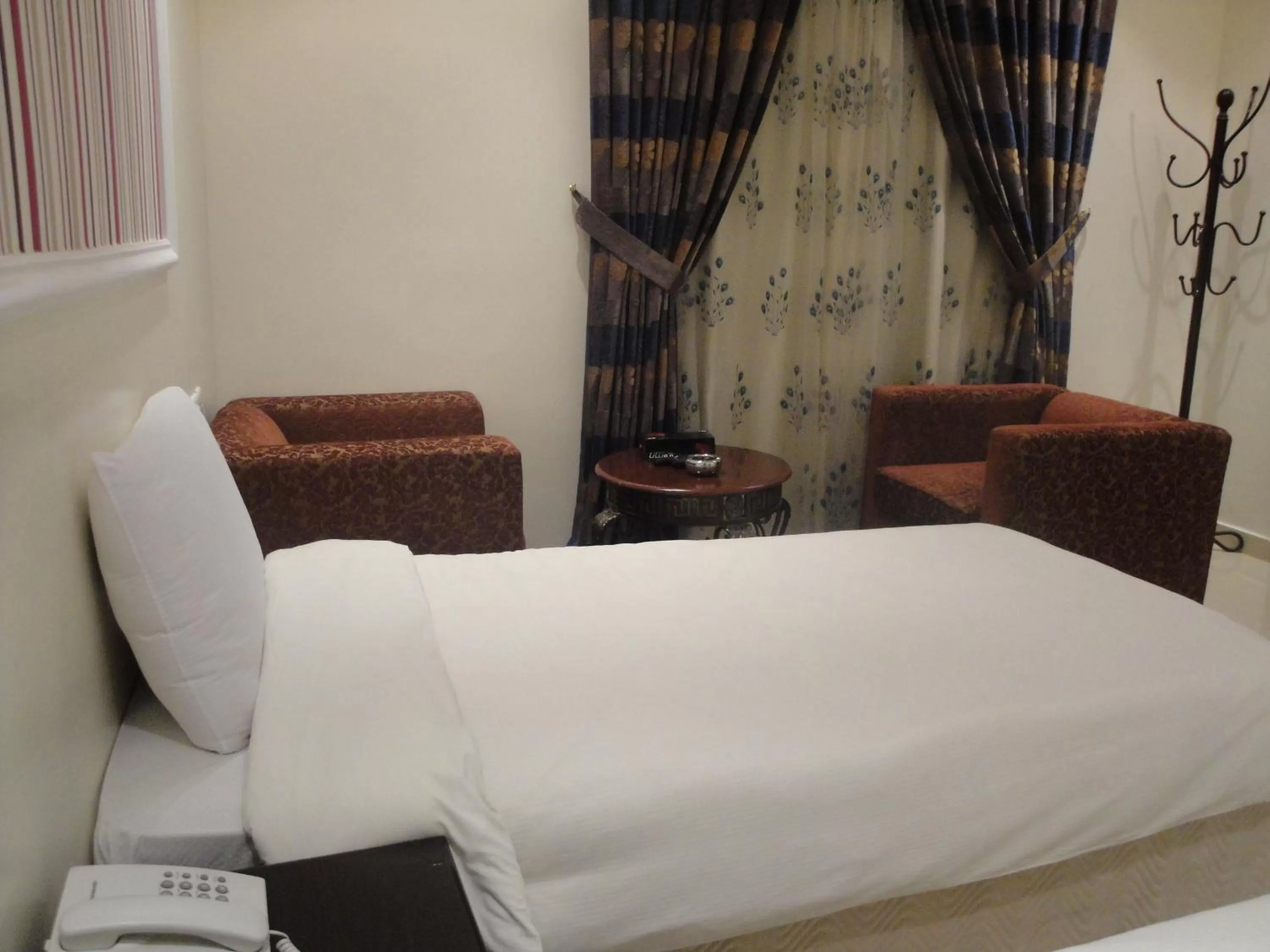 Bed in Marina Royal Hotel Suites