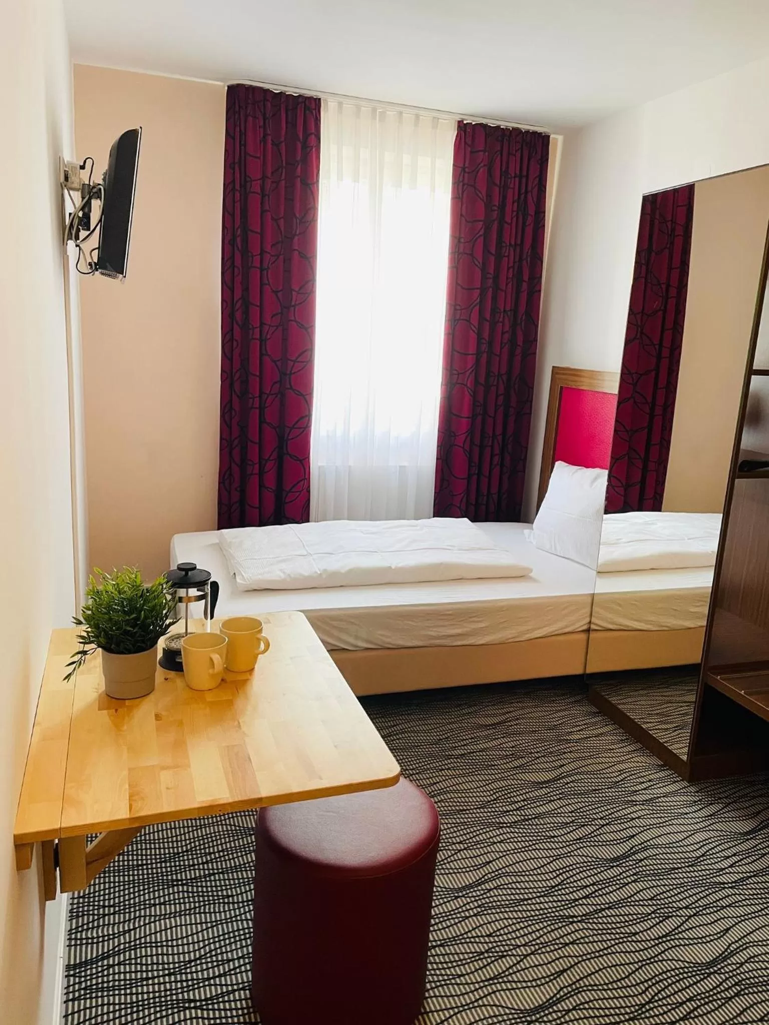 Bed in Point Hotel Apartments and Rooms