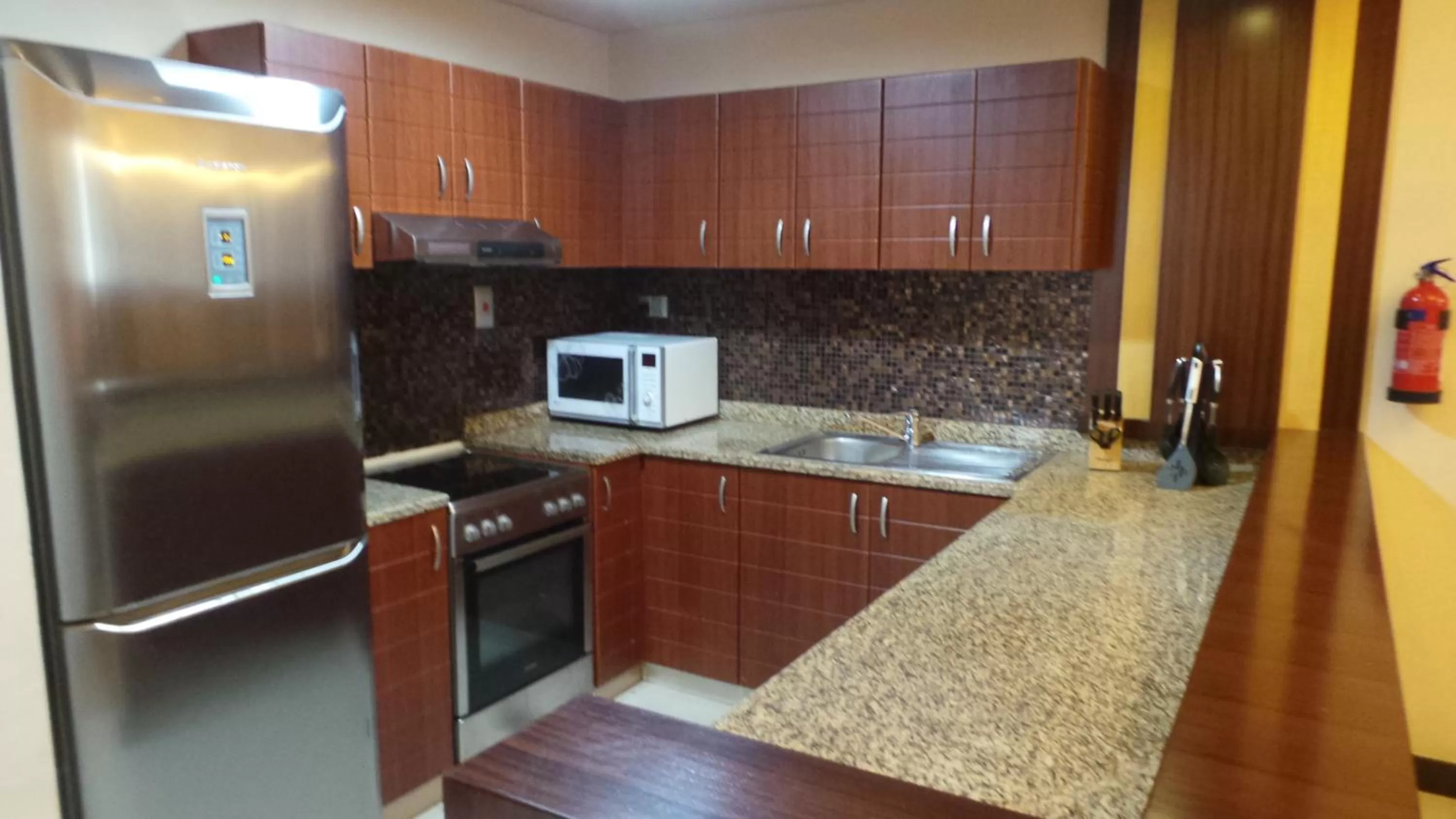 Kitchen or kitchenette in Xclusive Maples Hotel Apartment