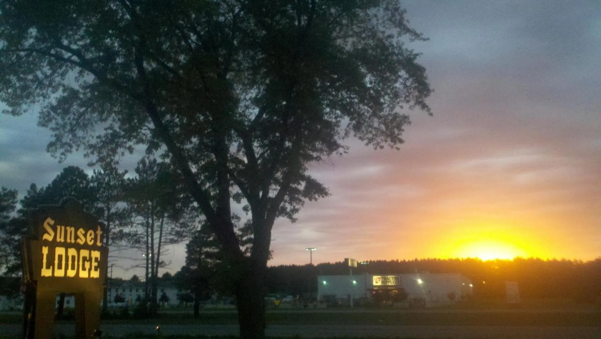 Property logo or sign in Sunset Lodge Escanaba