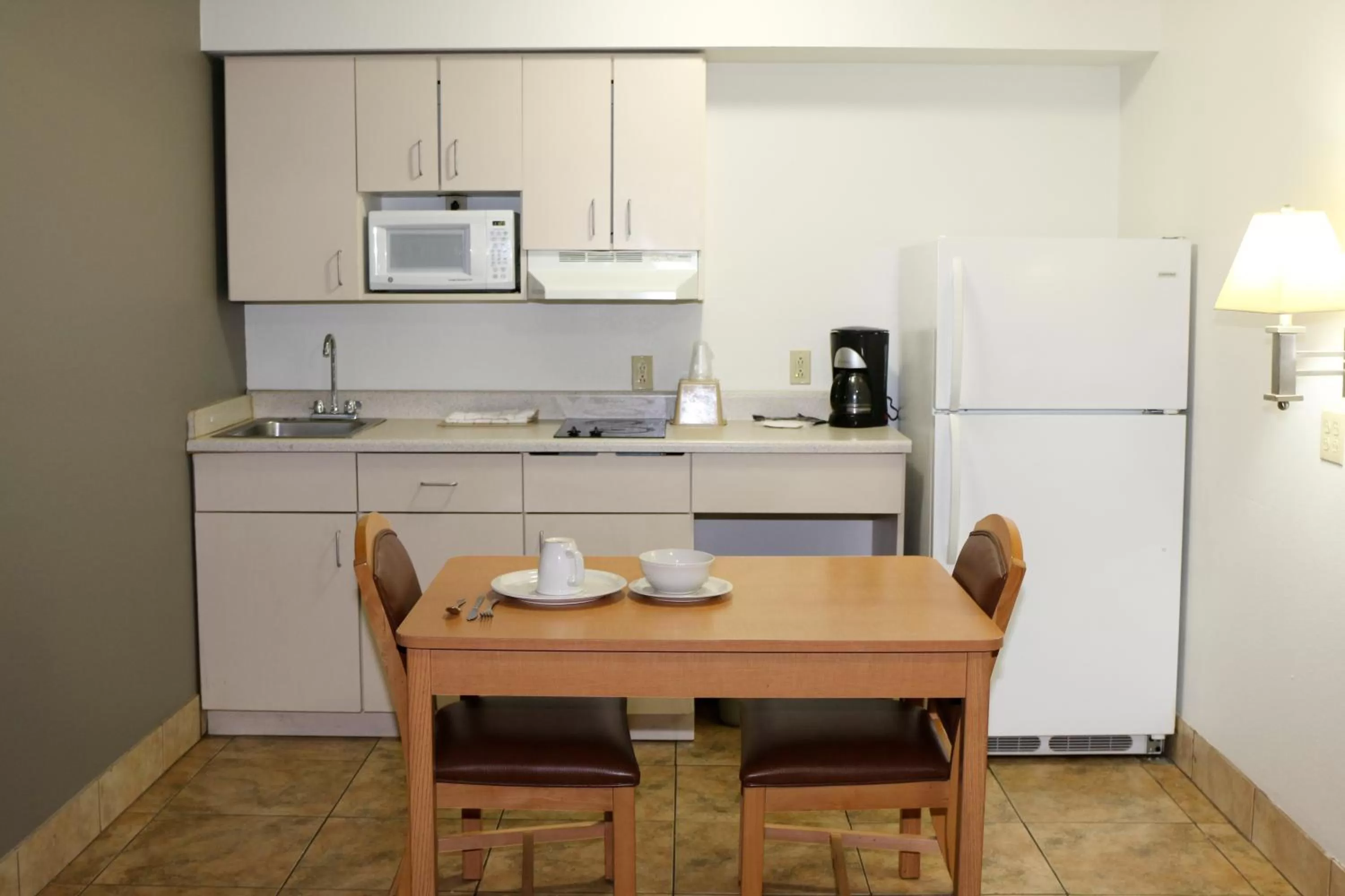 Kitchen or kitchenette in Blue Bonnet Suites -Lubbock, TX - Medical Center