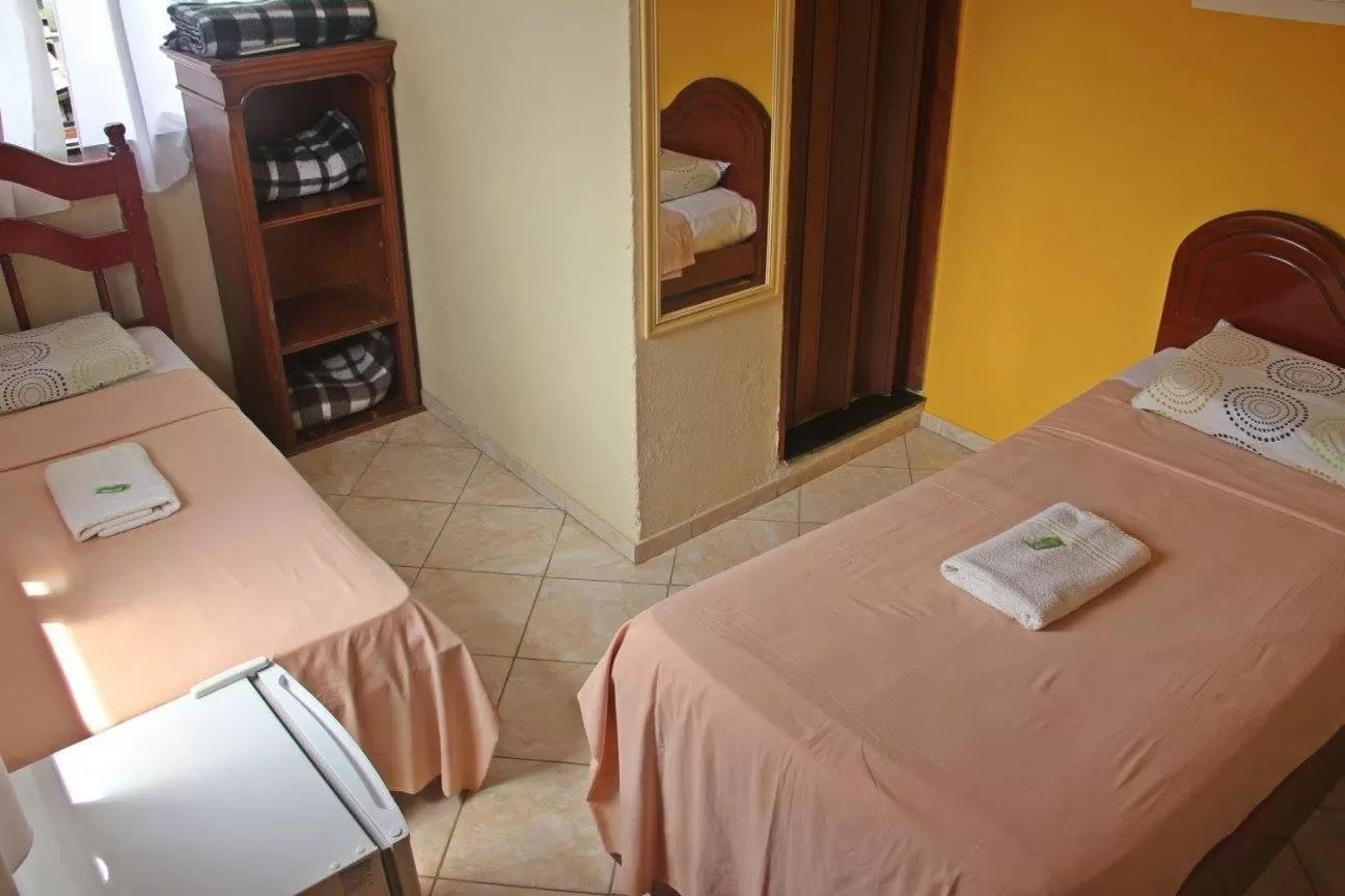 Bed in Pousada da Rose Paraty