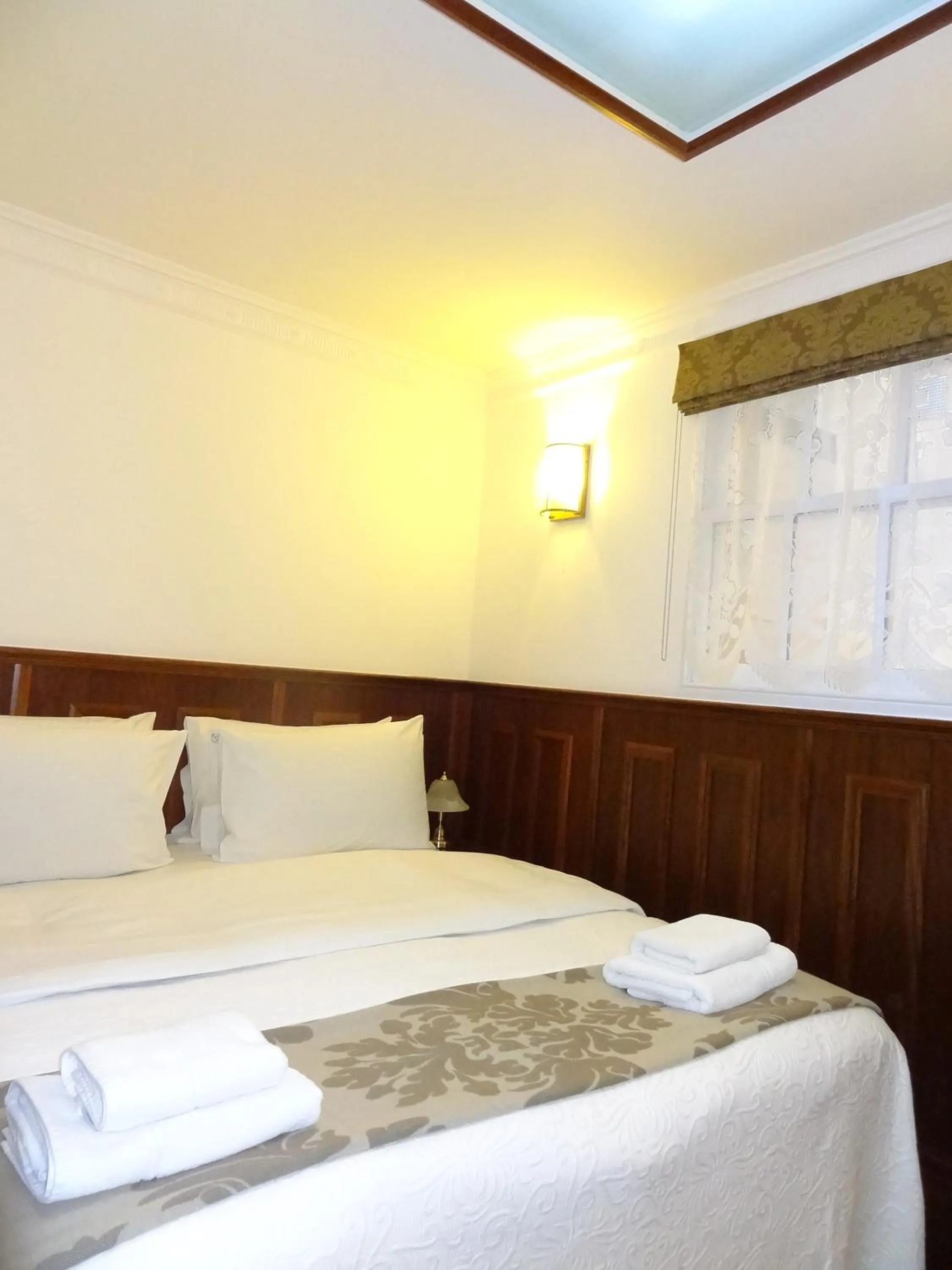 Bed in Regency House Hotel