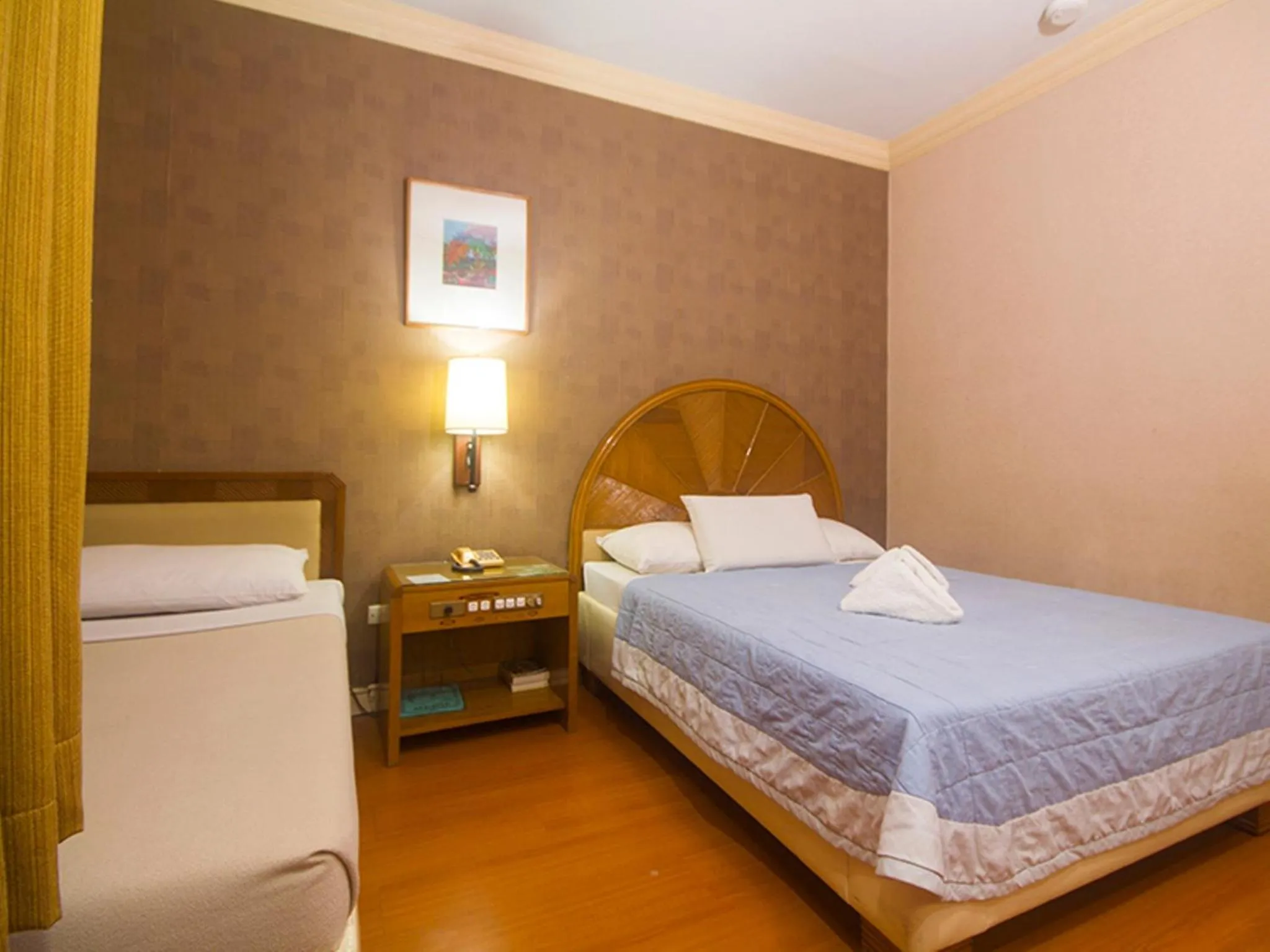 Bed in Grand City Hotel Inc.