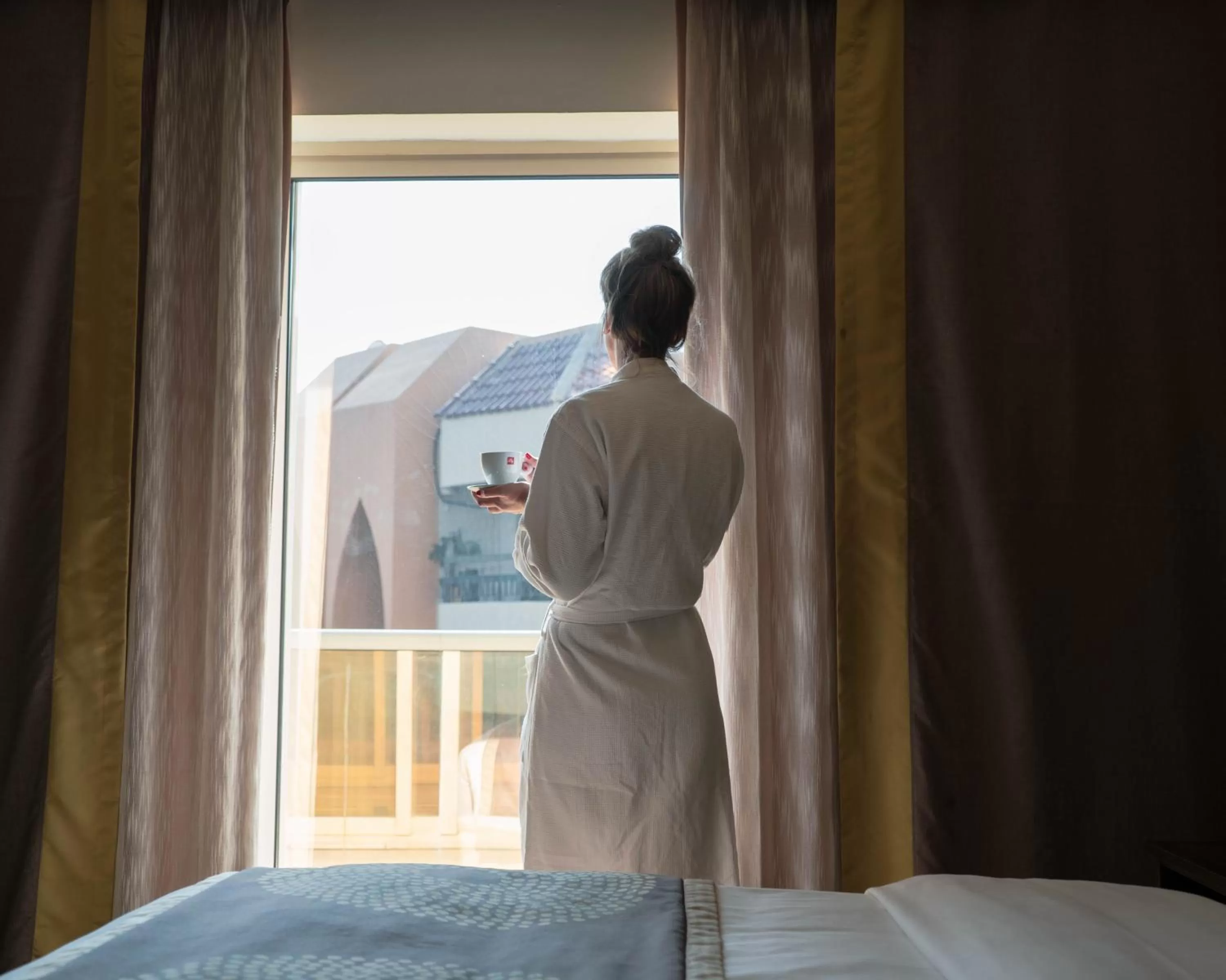 Bed in Savoy Central Hotel Apartments