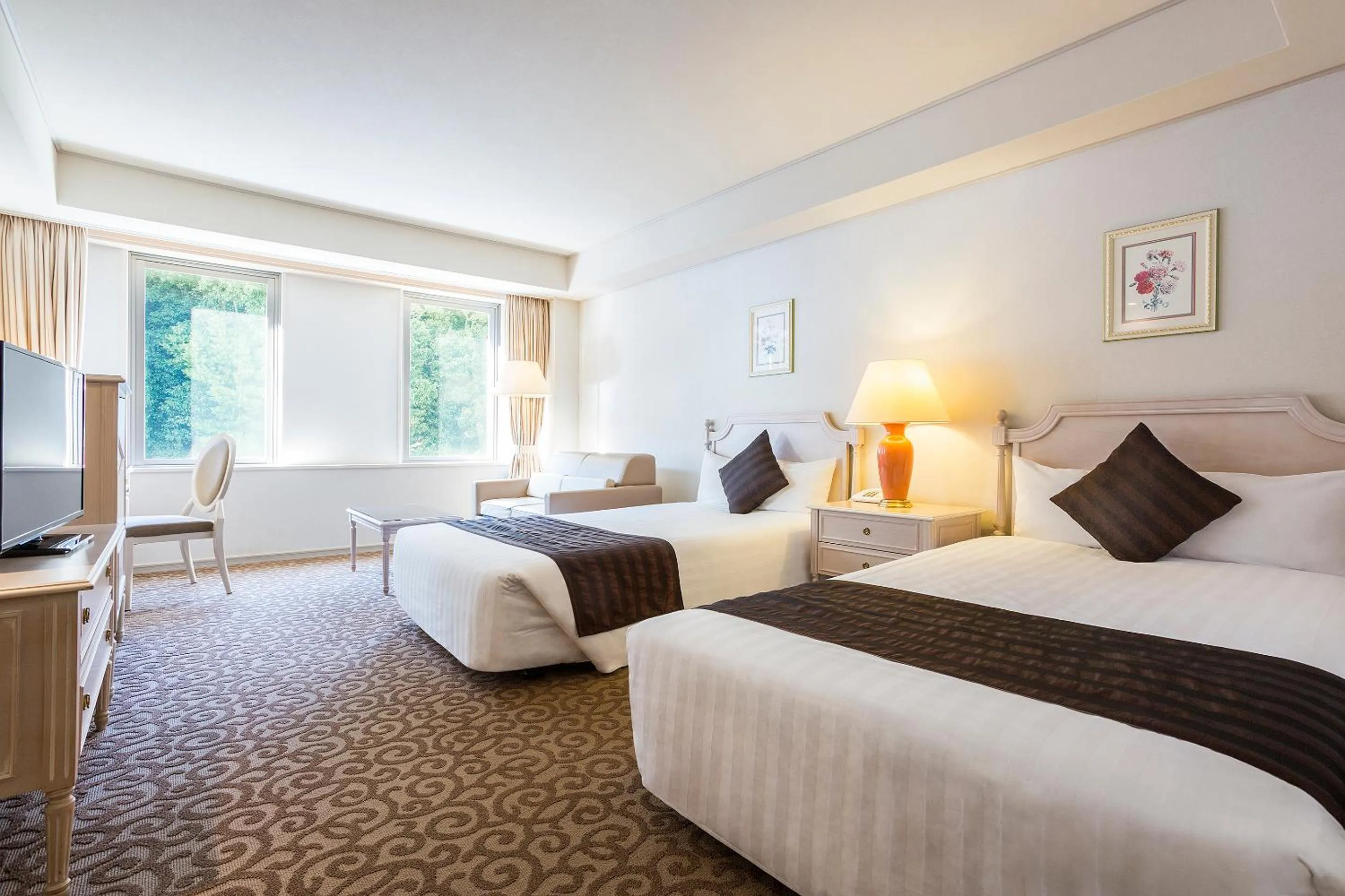 Bed in Luke Plaza Hotel