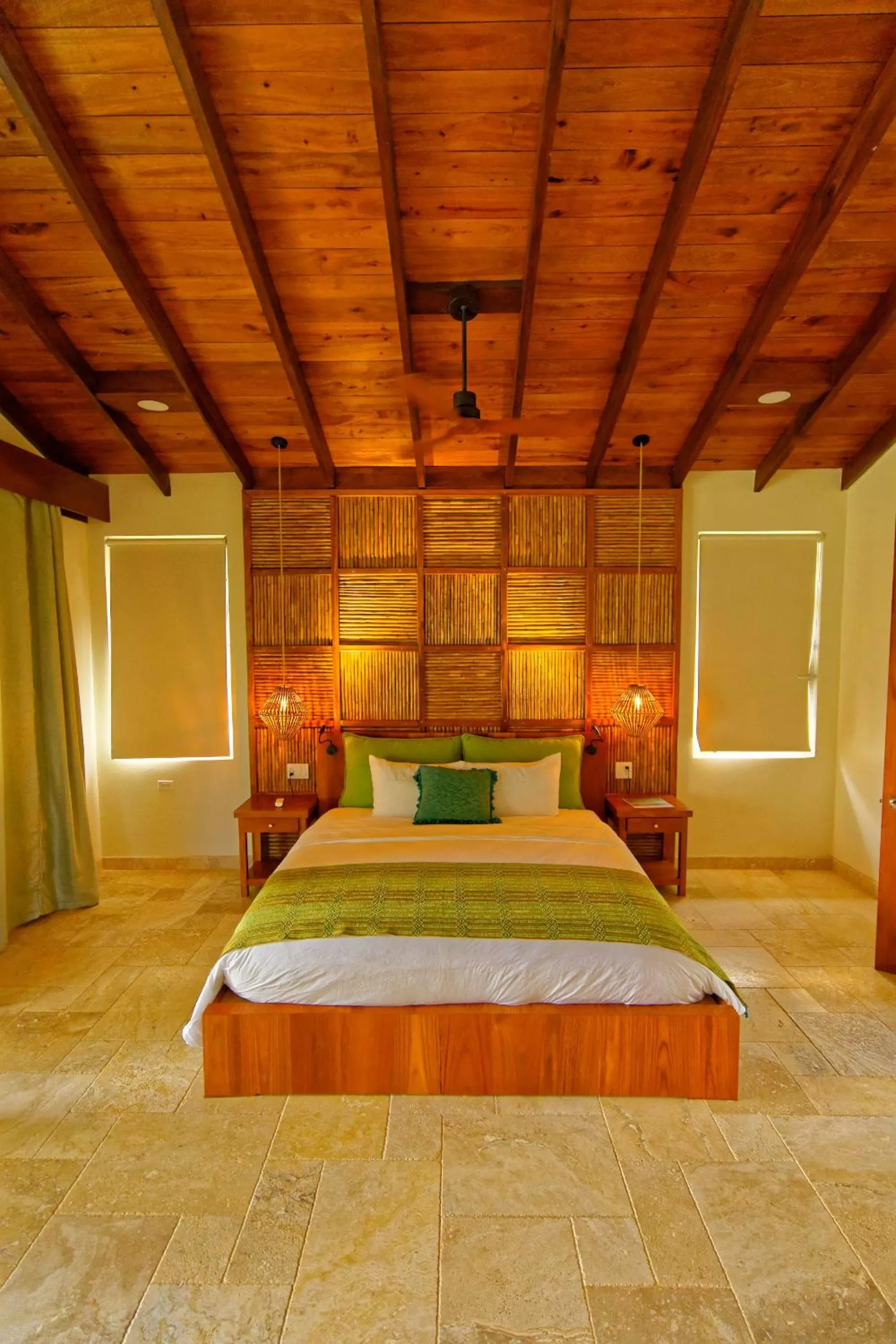 Bed in Sleeping Giant Rainforest Lodge