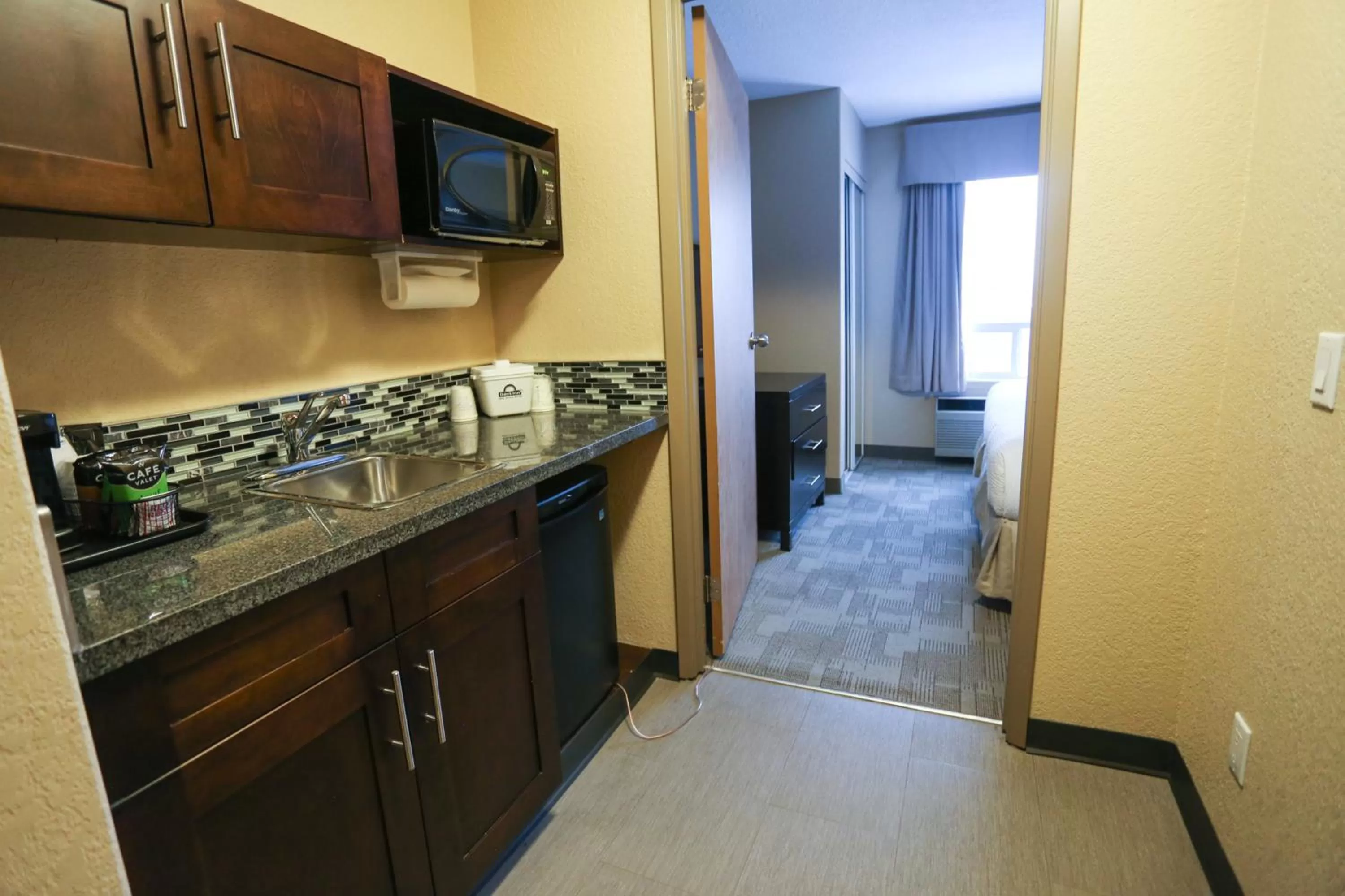 Kitchen or kitchenette in Days Inn by Wyndham Calgary Airport
