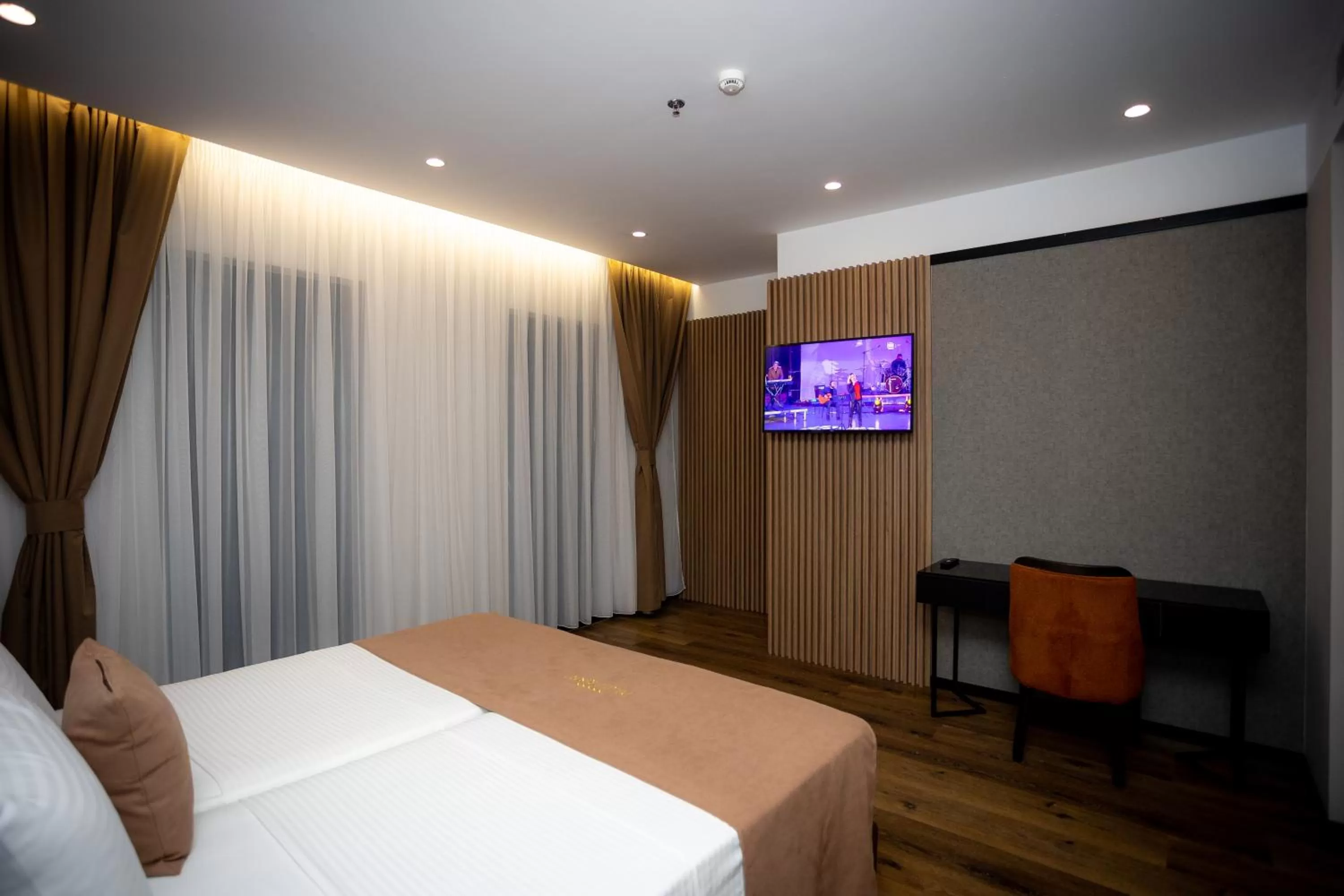 Photo of the whole room, TV/Entertainment Center in Deluxe Resort and SPA