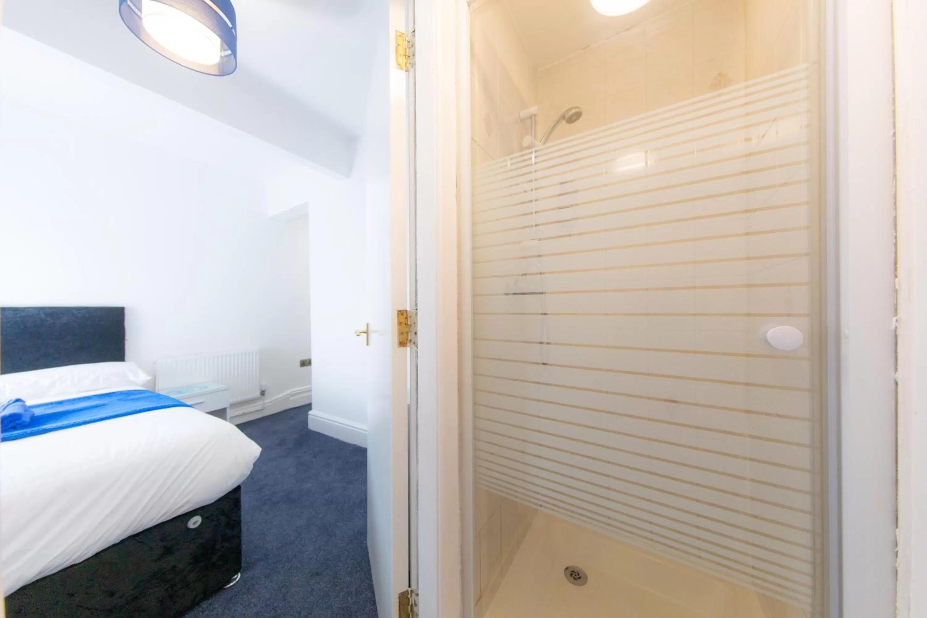 Bed in The Adonis Hotel