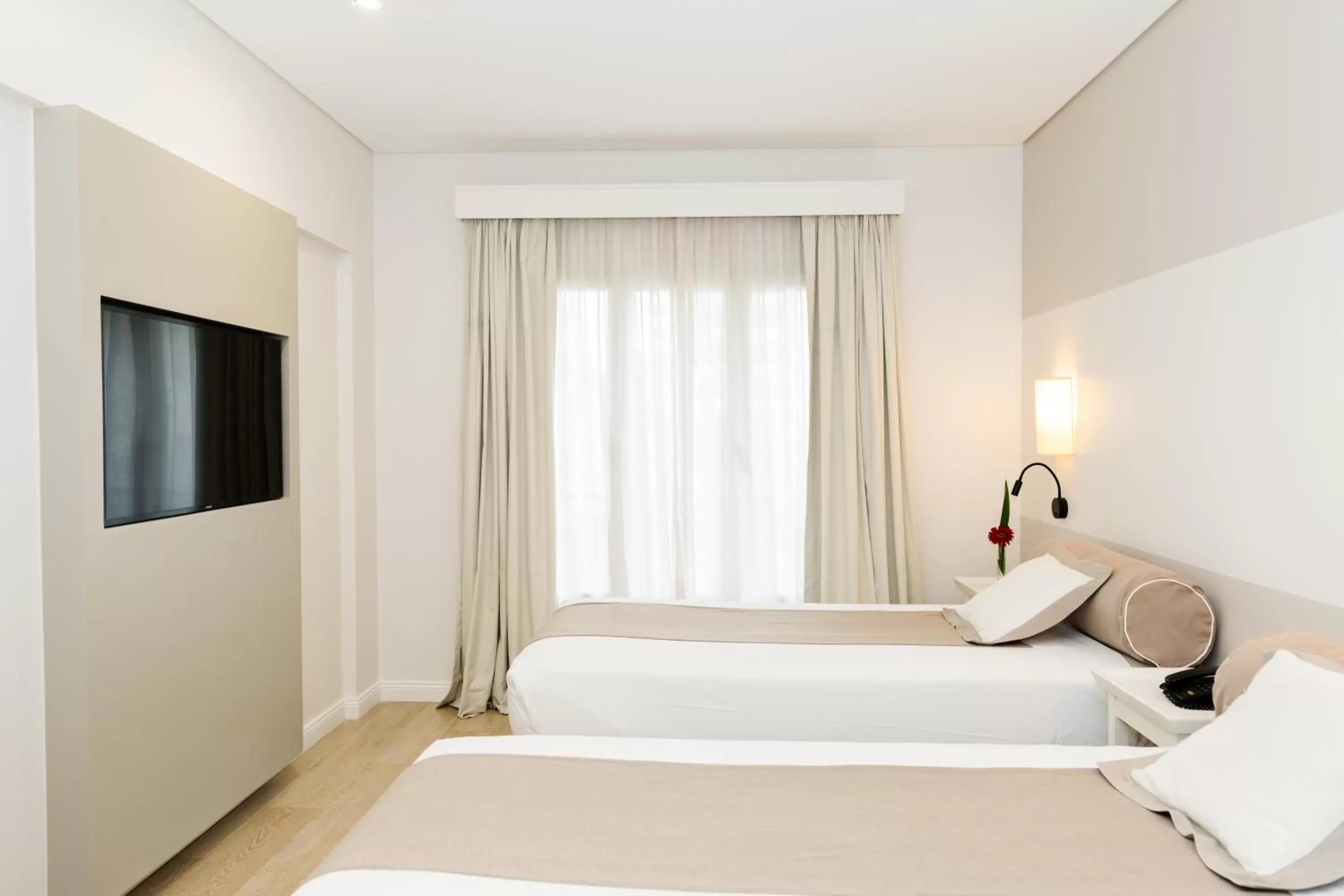 Bed in Loi Suites Recoleta Hotel