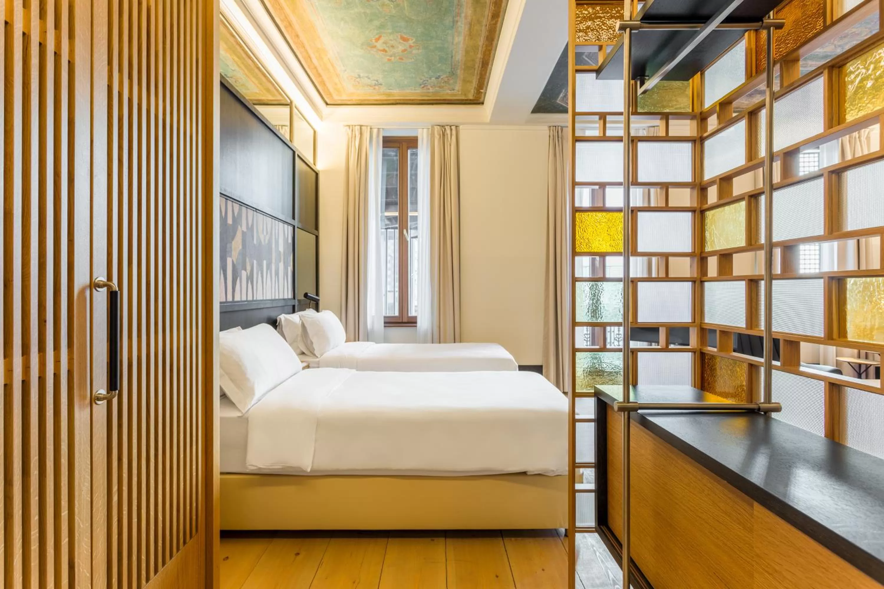 Bed in The Wings Hotels Collection