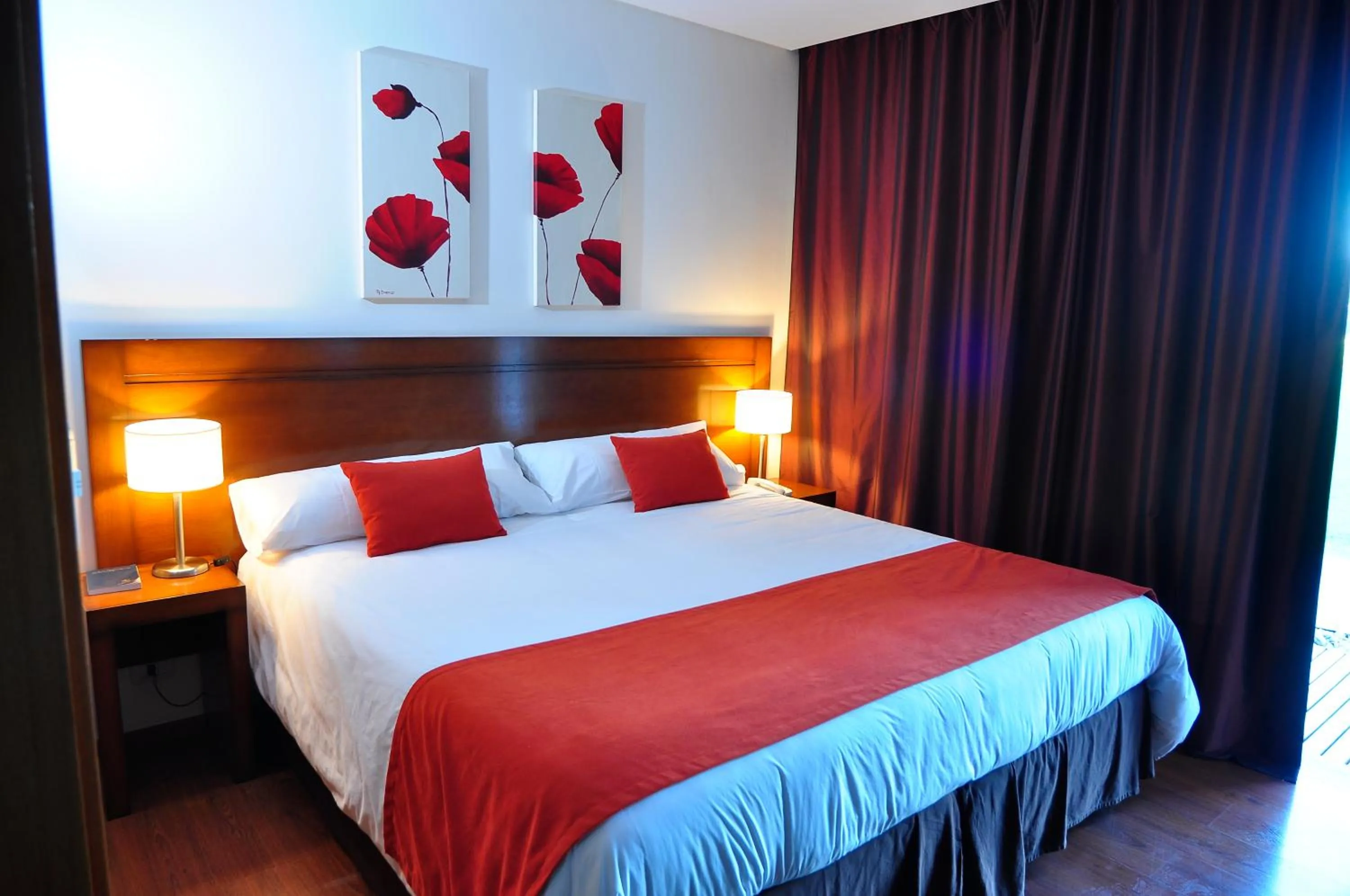 Bed in Herradura Hotel Suites