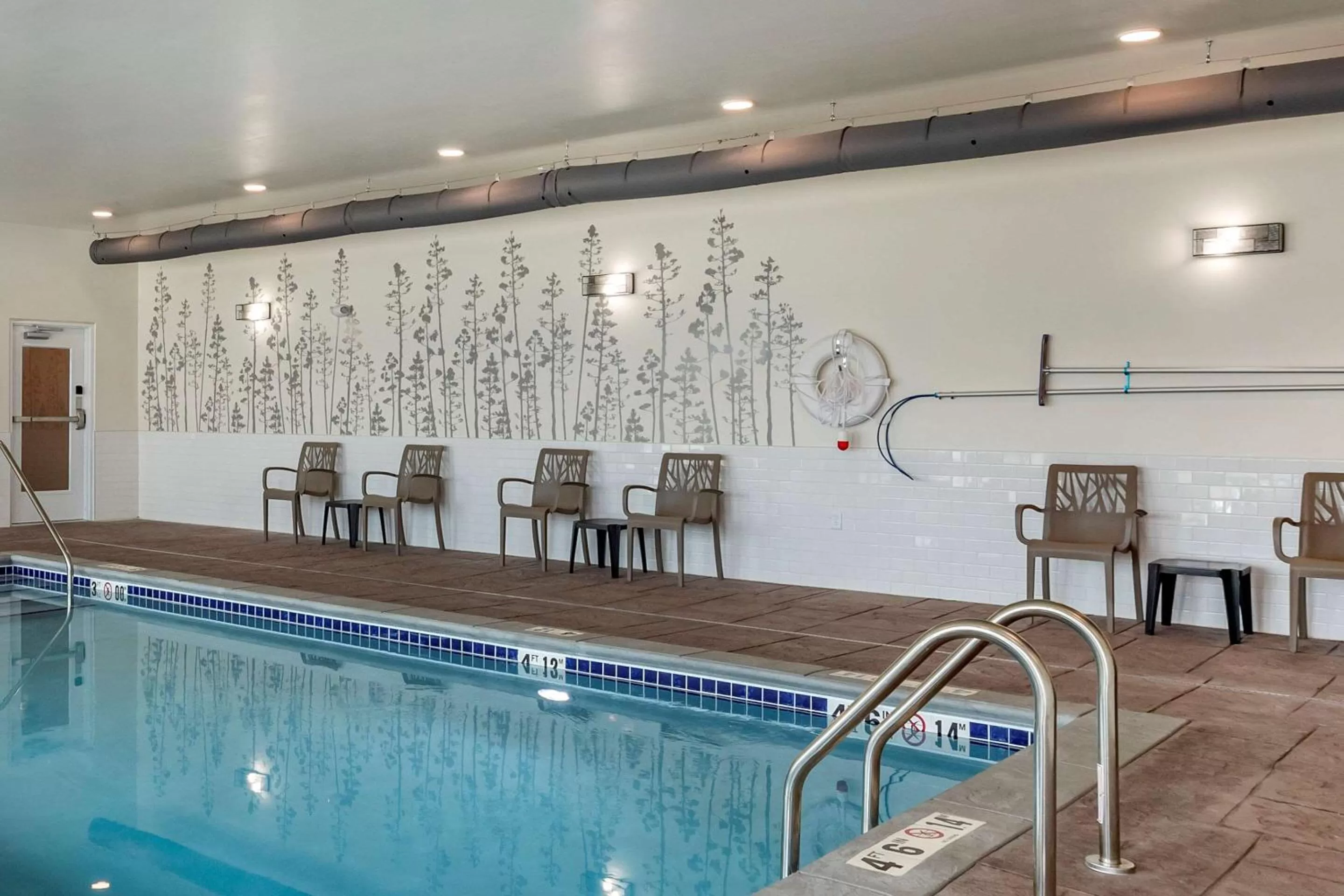 Swimming pool in MainStay Suites Waukee-West Des Moines
