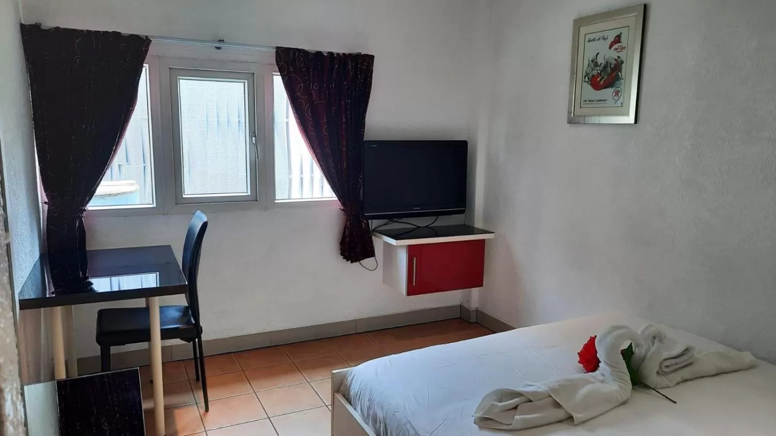 Photo of the whole room, TV/Entertainment Center in Swiss Food Restaurant and room for rent