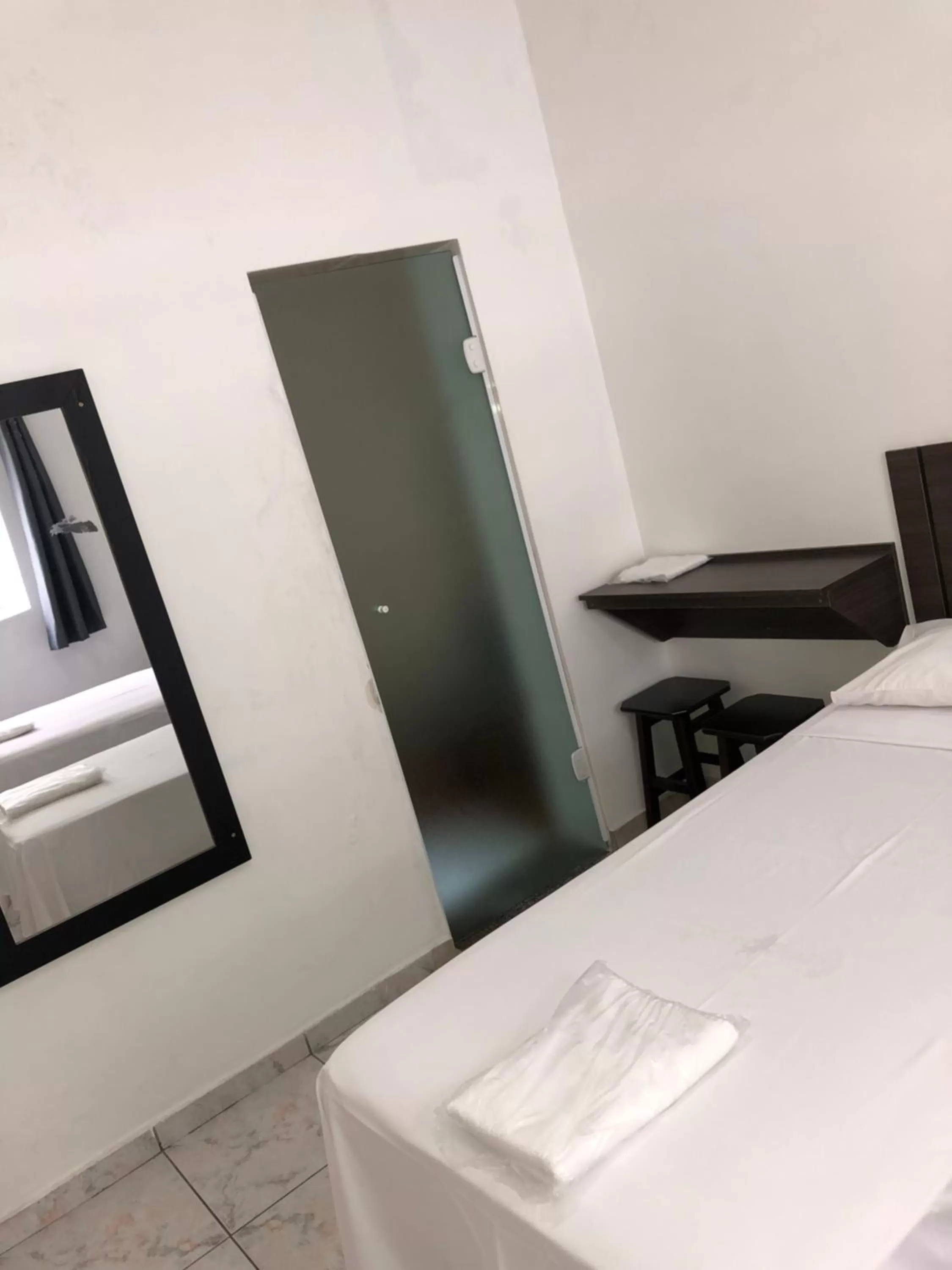 Bed in Center Plaza Hotel