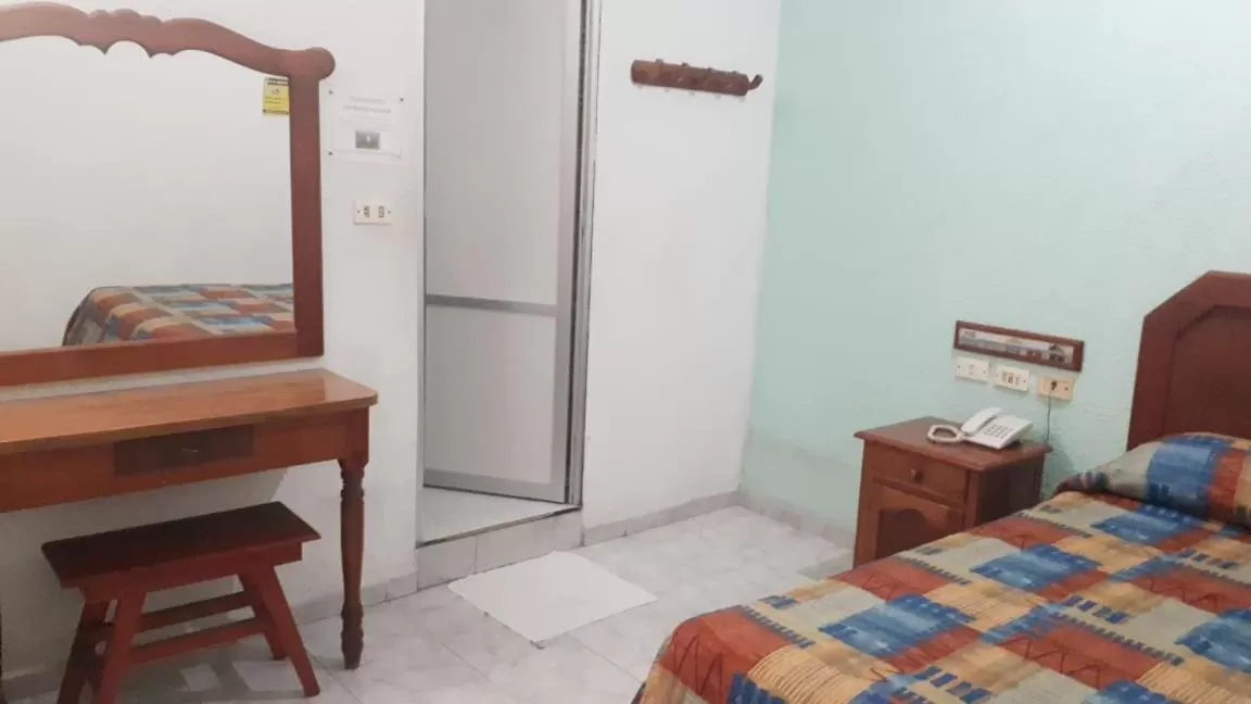 Bed in Hotel Azteca Tabasco