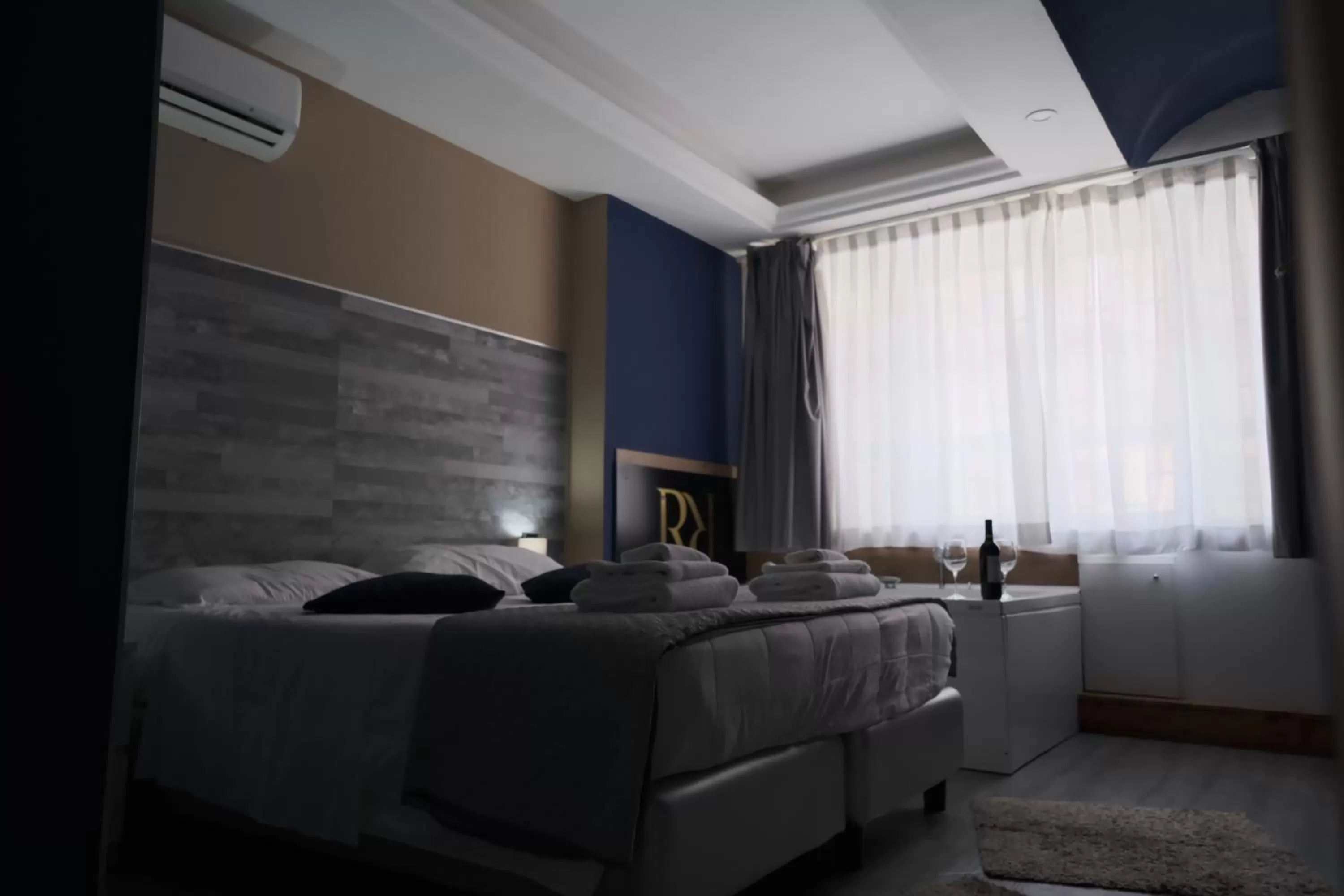 Bed in Royalty Rooms & Spa