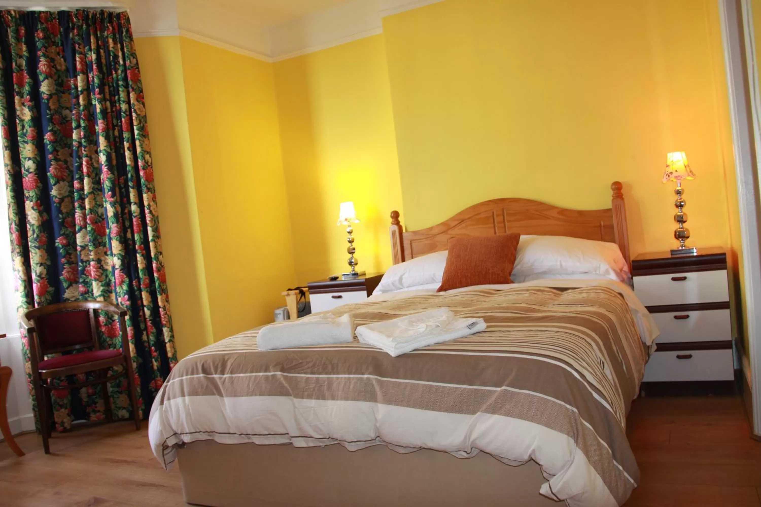 Bed in Ambassador Hotel