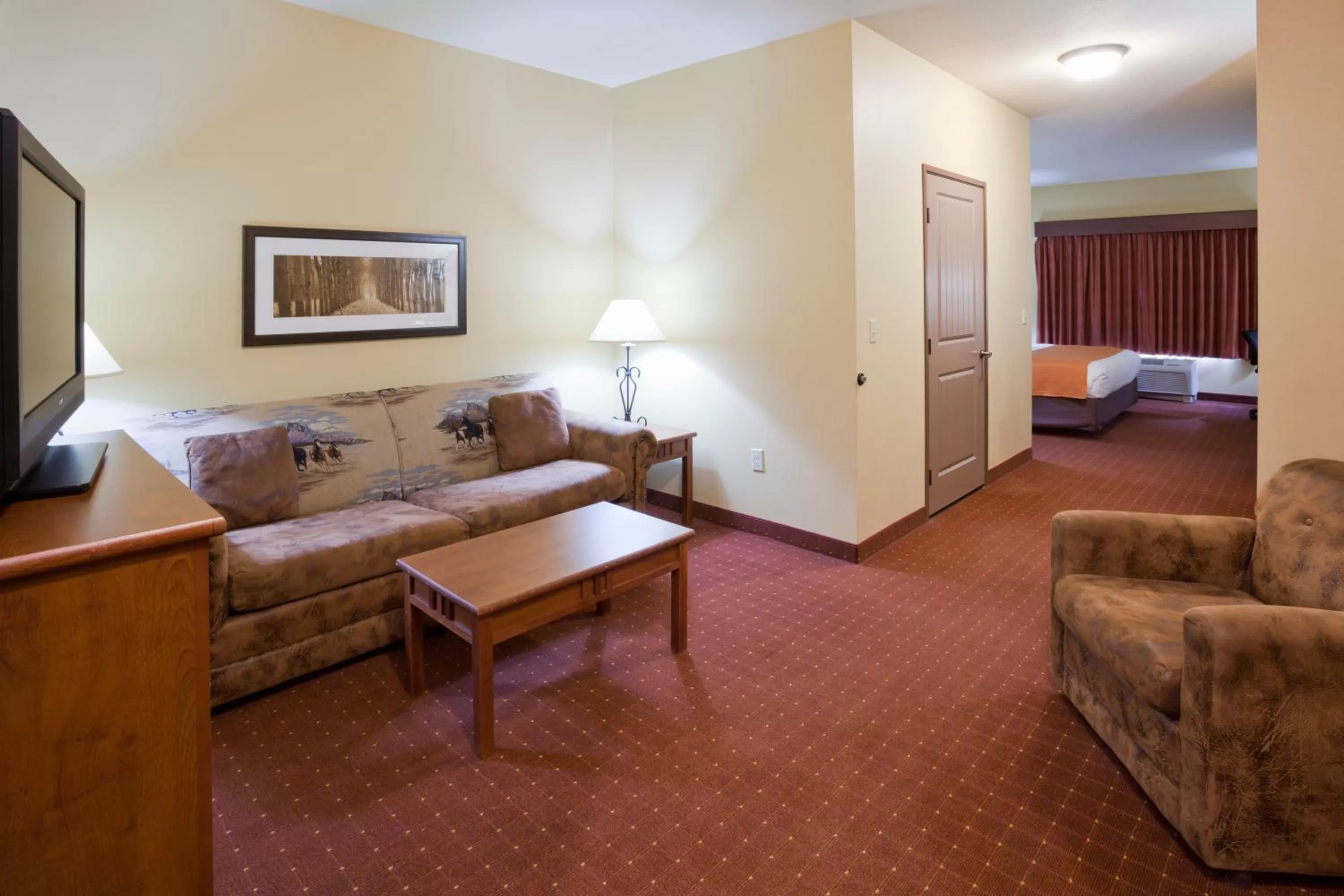 Living room, Bed in AmericInn by Wyndham Fargo Medical Center