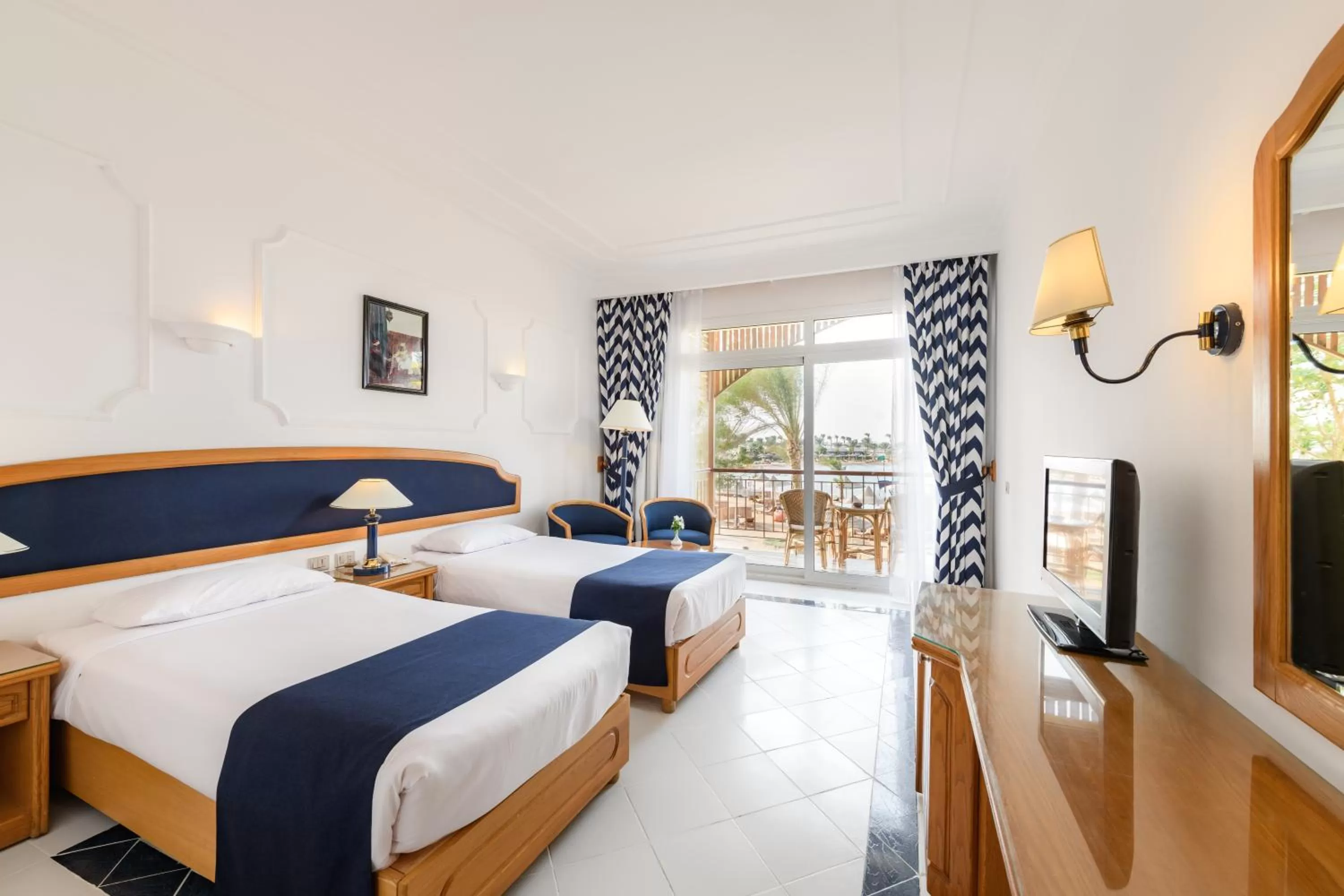 Photo of the whole room, Bed in Desert Rose Resort