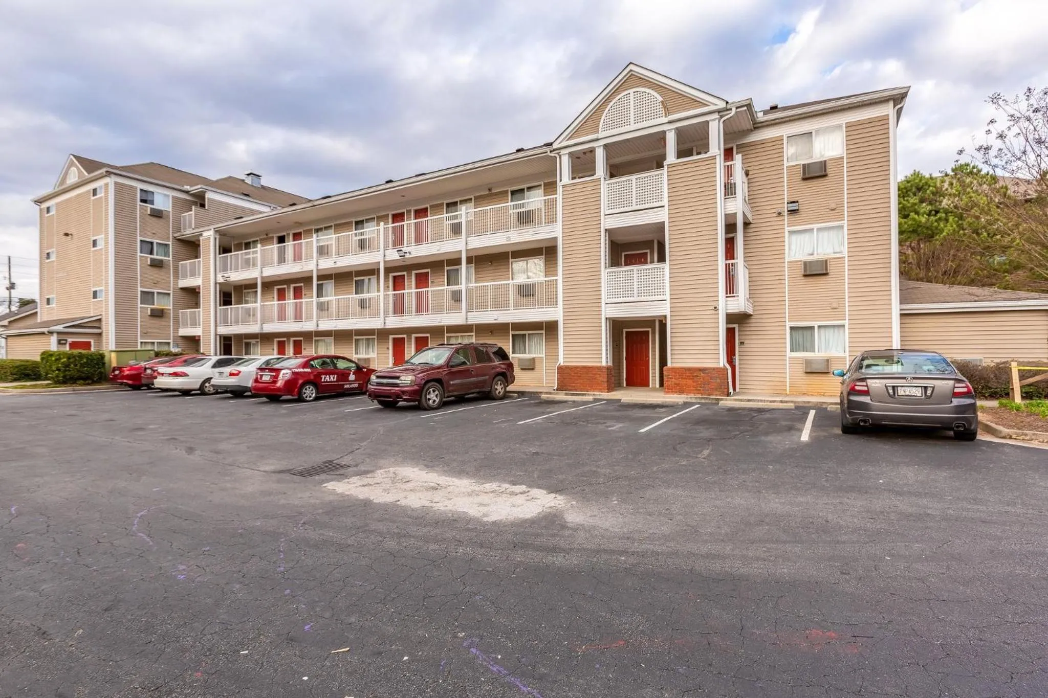 Property building in HomeTowne Studios by Red Roof Gainesville, GA