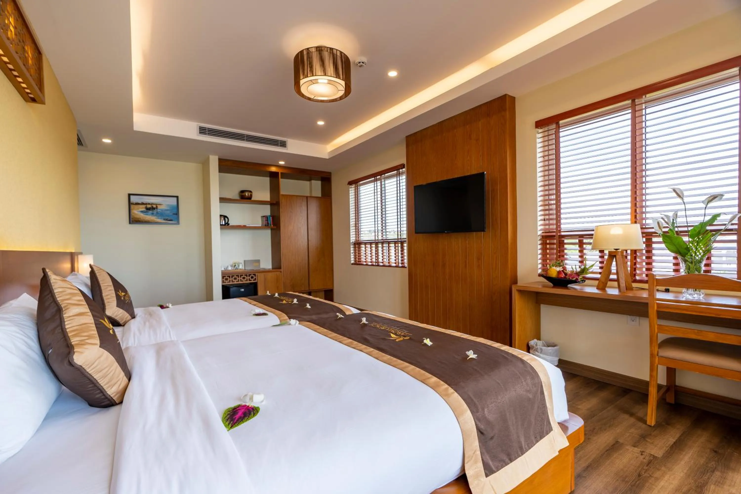 Bed in Aroma Beach Resort and Spa