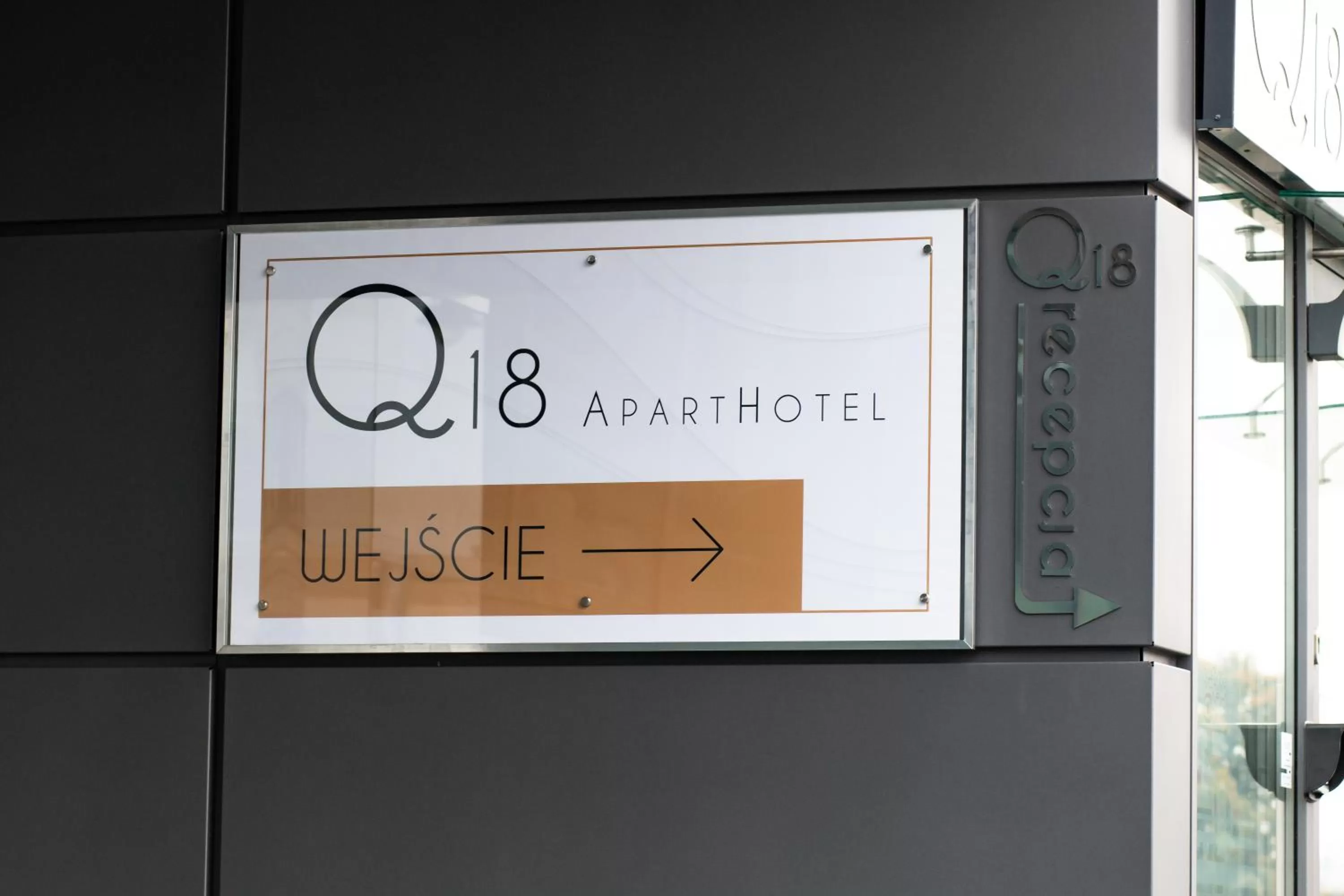 Property logo or sign in Q18 ApartHotel