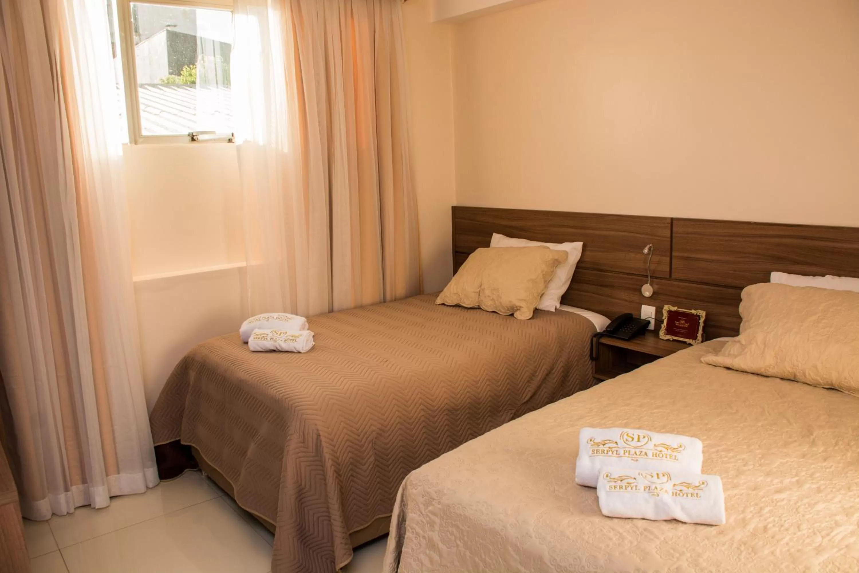 Bed in SERPYL Plaza Hotel