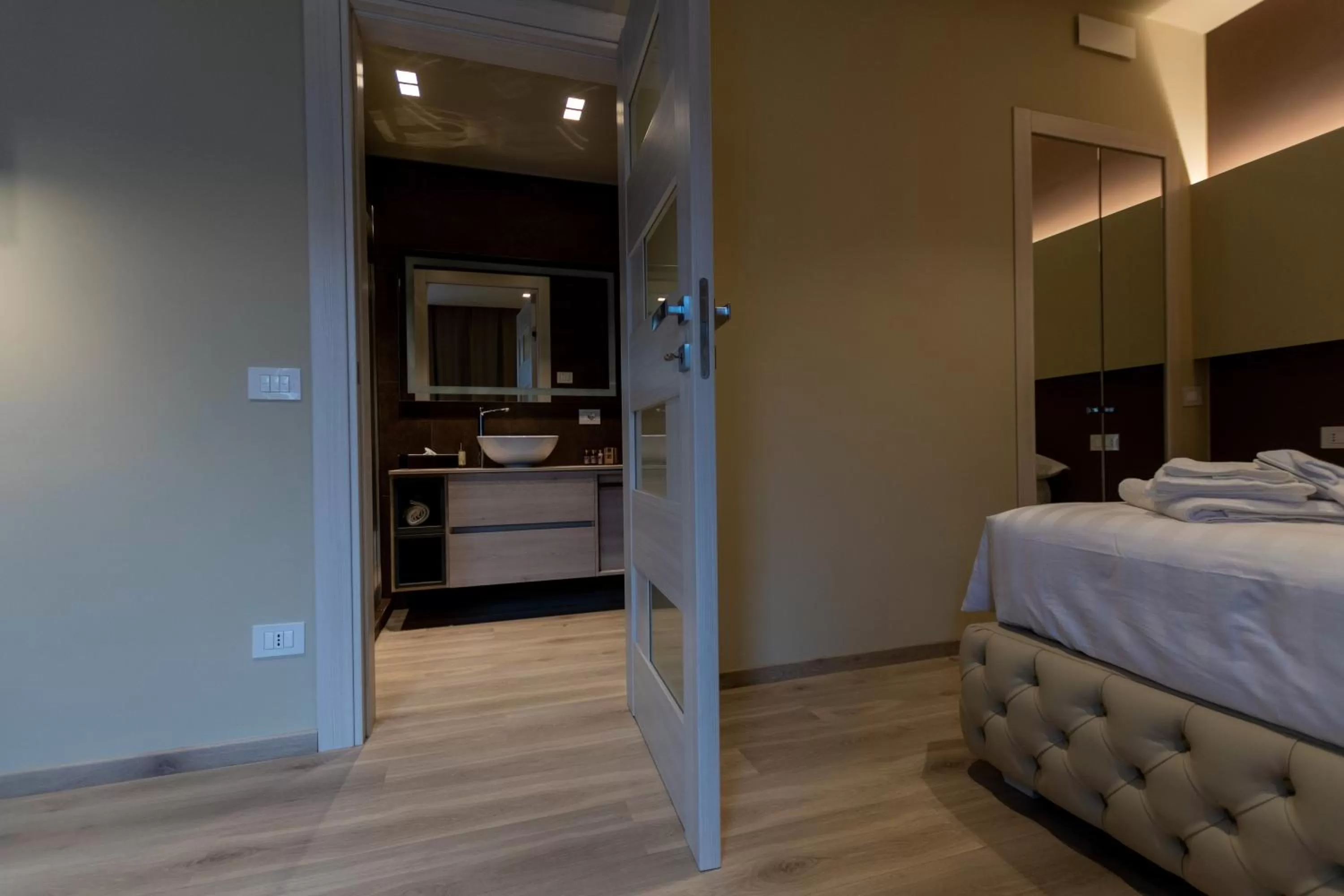 Bed in DiVino Rooms Deluxe
