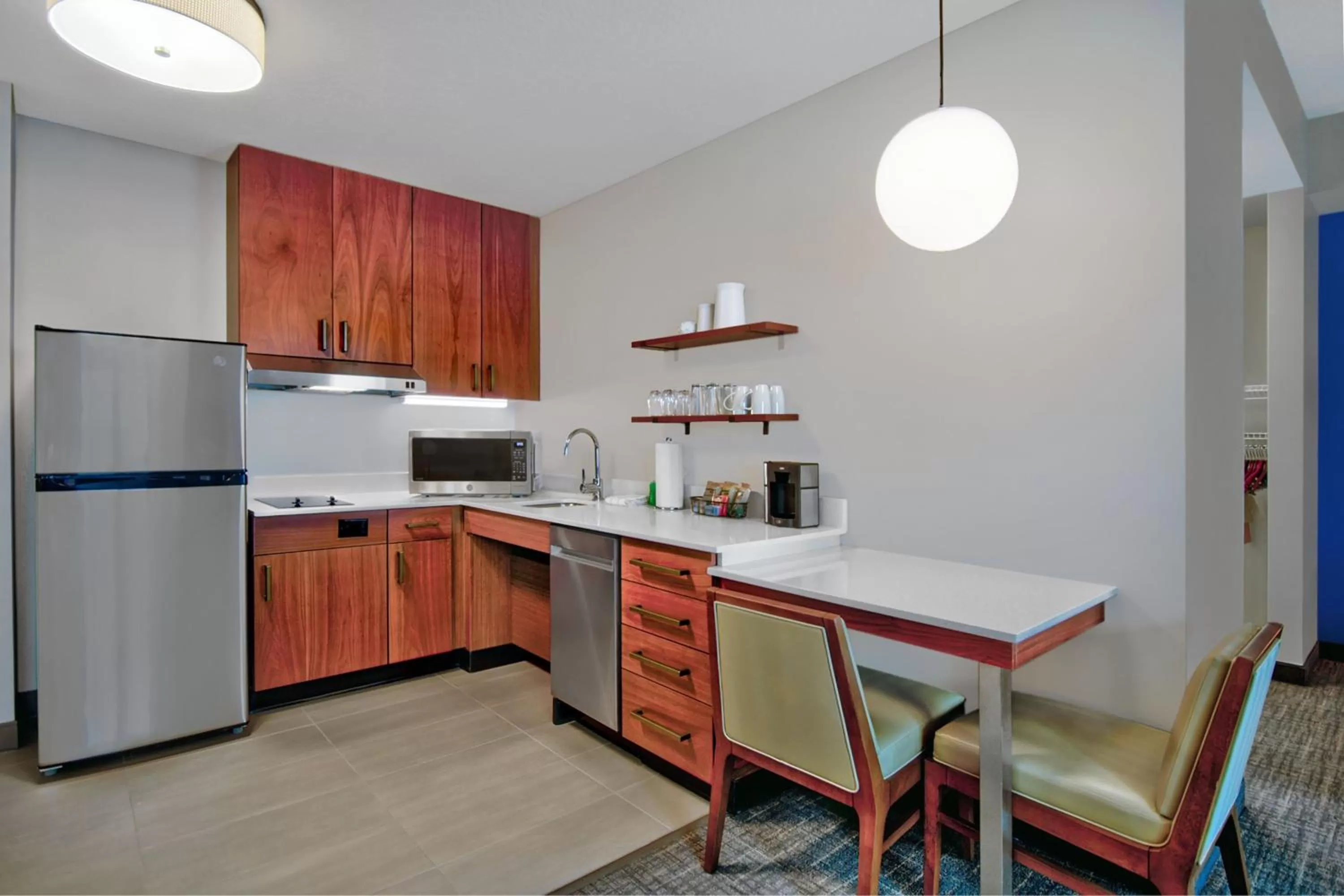 Kitchen or kitchenette in Residence Inn by Marriott Orlando at FLAMINGO CROSSINGS Town Center